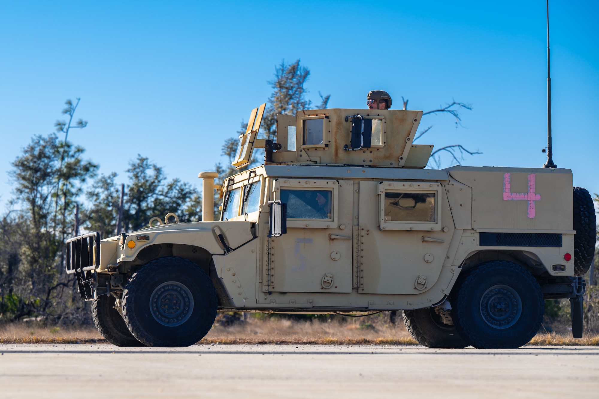 U.S. Airmen assigned to the 11th Air Task Force drive a Humvee vehicle as part of convoy training at Tyndall Air Force Base, Florida, Jan. 23, 2025. Convoys transported supplies and personnel. (U.S. Air Force photo by Senior Airman Jasmyne Bridgers-Matos)