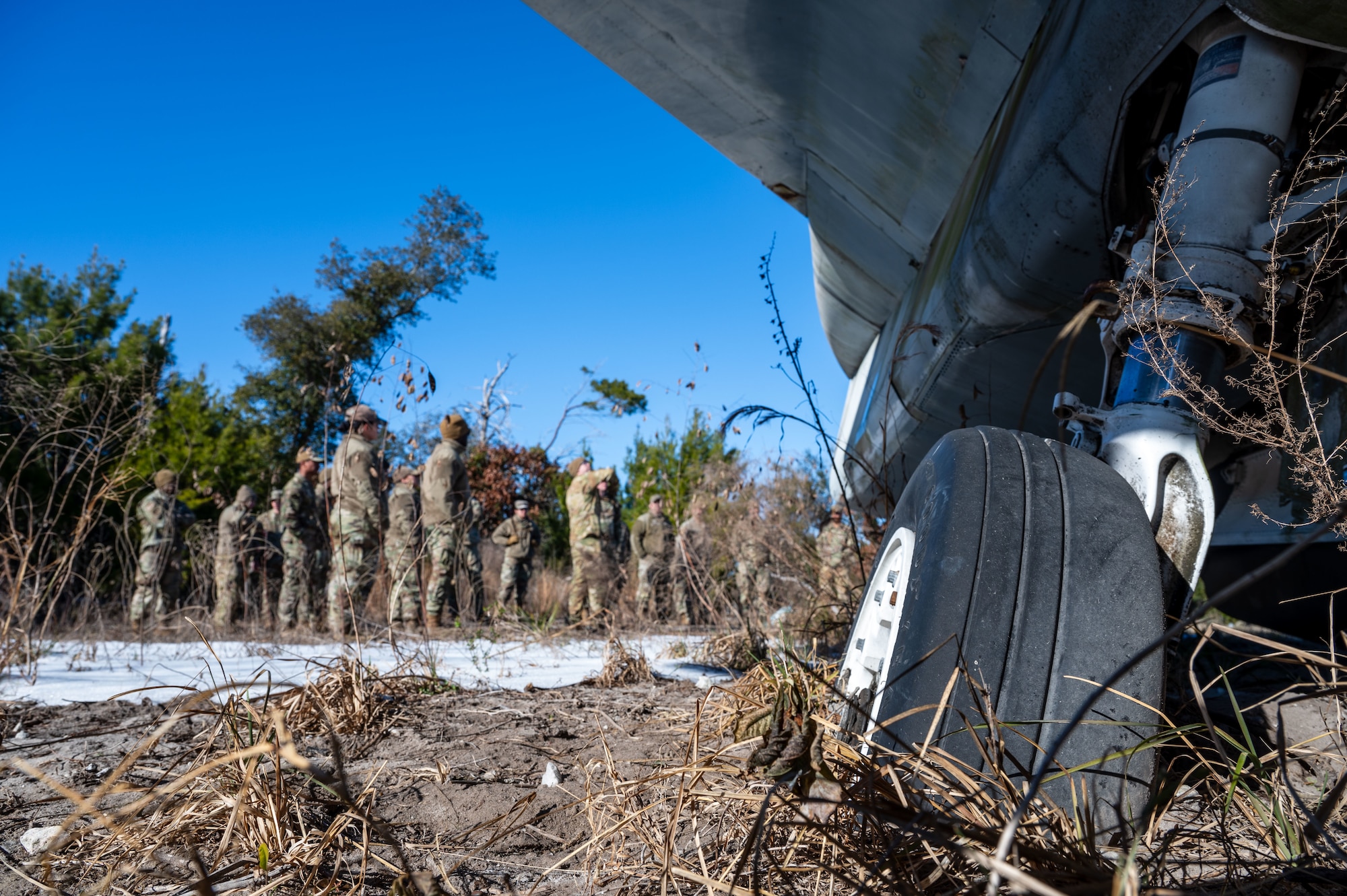 U.S. Airmen assigned to the 11th Air Task Force participate in a simulated pilot egress during personnel rescue and incident mitigation training at Tyndall Air Force Base, Florida, Jan. 23, 2025. Airmen familiarized themselves with how to safely remove passengers from a downed aircraft. (U.S. Air Force photo by Senior Airman Jasmyne Bridgers-Matos)