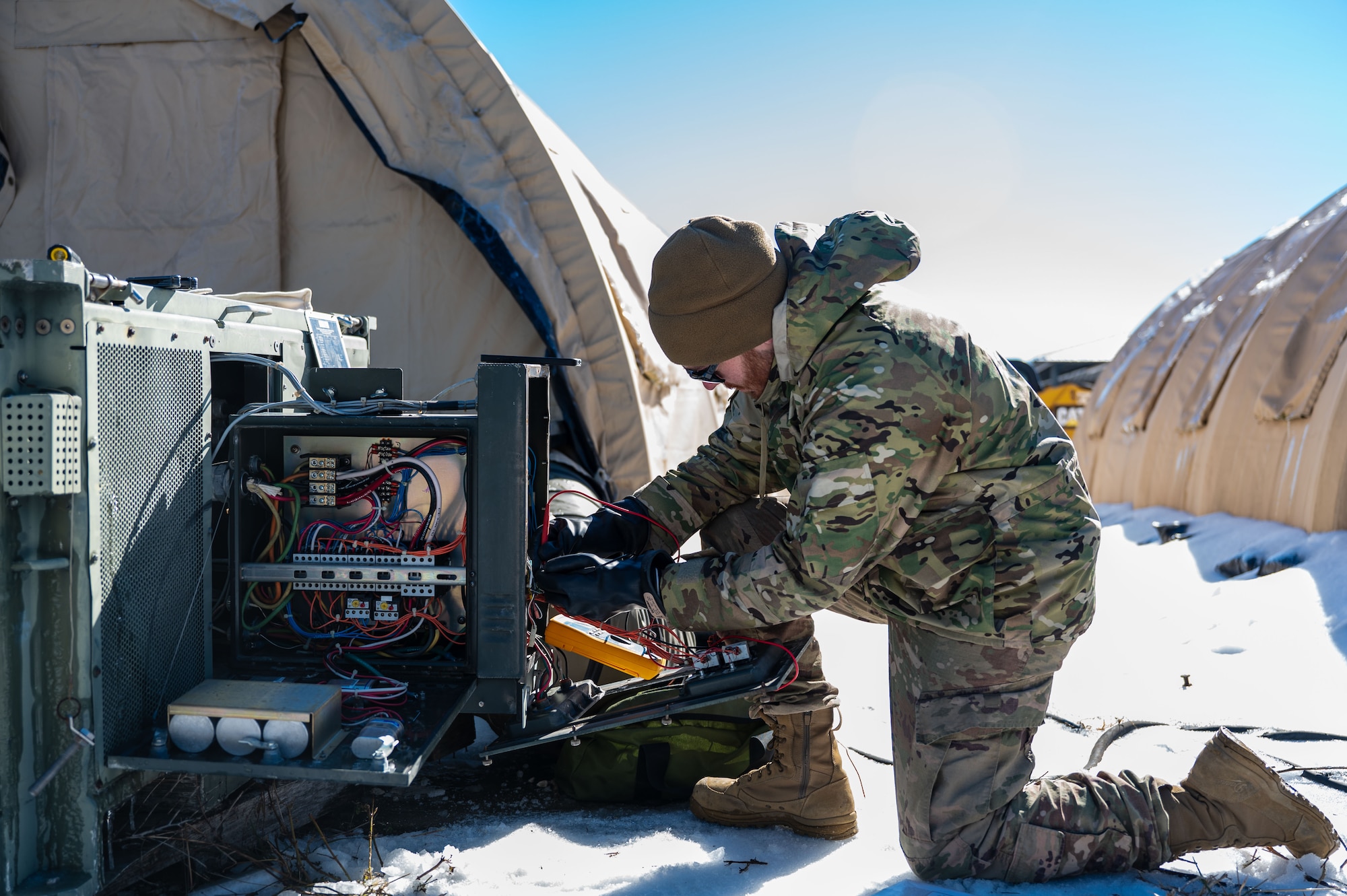 A U.S. Airman assigned to the 11th Air Task Force inspects a heating, ventilation and air conditioning unit at Tyndall Air Force Base, Florida, Jan. 22, 2025. Civil engineer Airmen evaluated units to determine if any needed to be replaced. (U.S. Air Force photo by Senior Airman Jasmyne Bridgers-Matos)