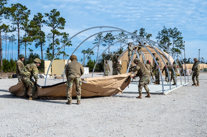 U.S. Airmen assigned to the 11th Air Task Force construct a tent at Tyndall Air Force Base, Florida, Jan. 21, 2025. The ability to set up a bare base capable of supporting the mission allows the 11th ATF to conduct operations in austere environments. (U.S. Air Force photo by Senior Airman Jasmyne Bridgers-Matos)