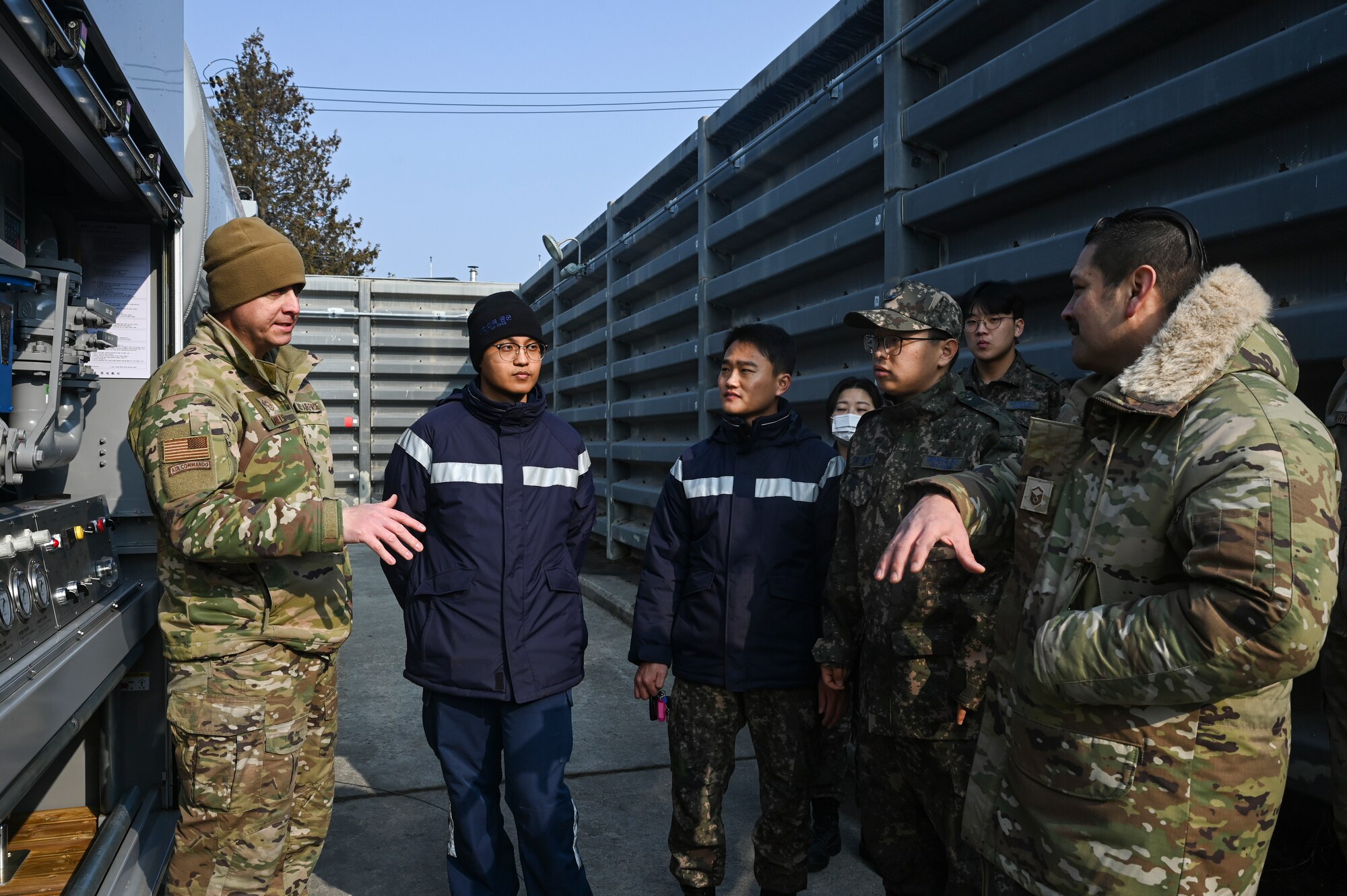 Airmen from the 8th Logistics Readiness Squadron petroleum, oils, and lubricants flight, speak with Airmen assigned to the Republic of Korea Air Force 38th Battalion Supply Company