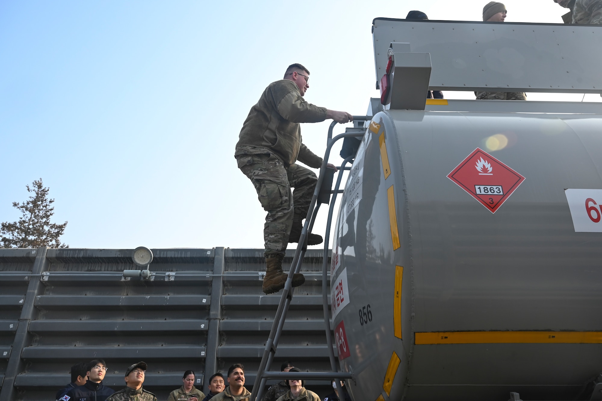 U.S. Air Force Tech. Sgt. Brandon Craver, 8th Logistics Readiness Squadron fuels training support craftsman, climbs a new Republic of Korea Air Force aircraft refueling unit ladder