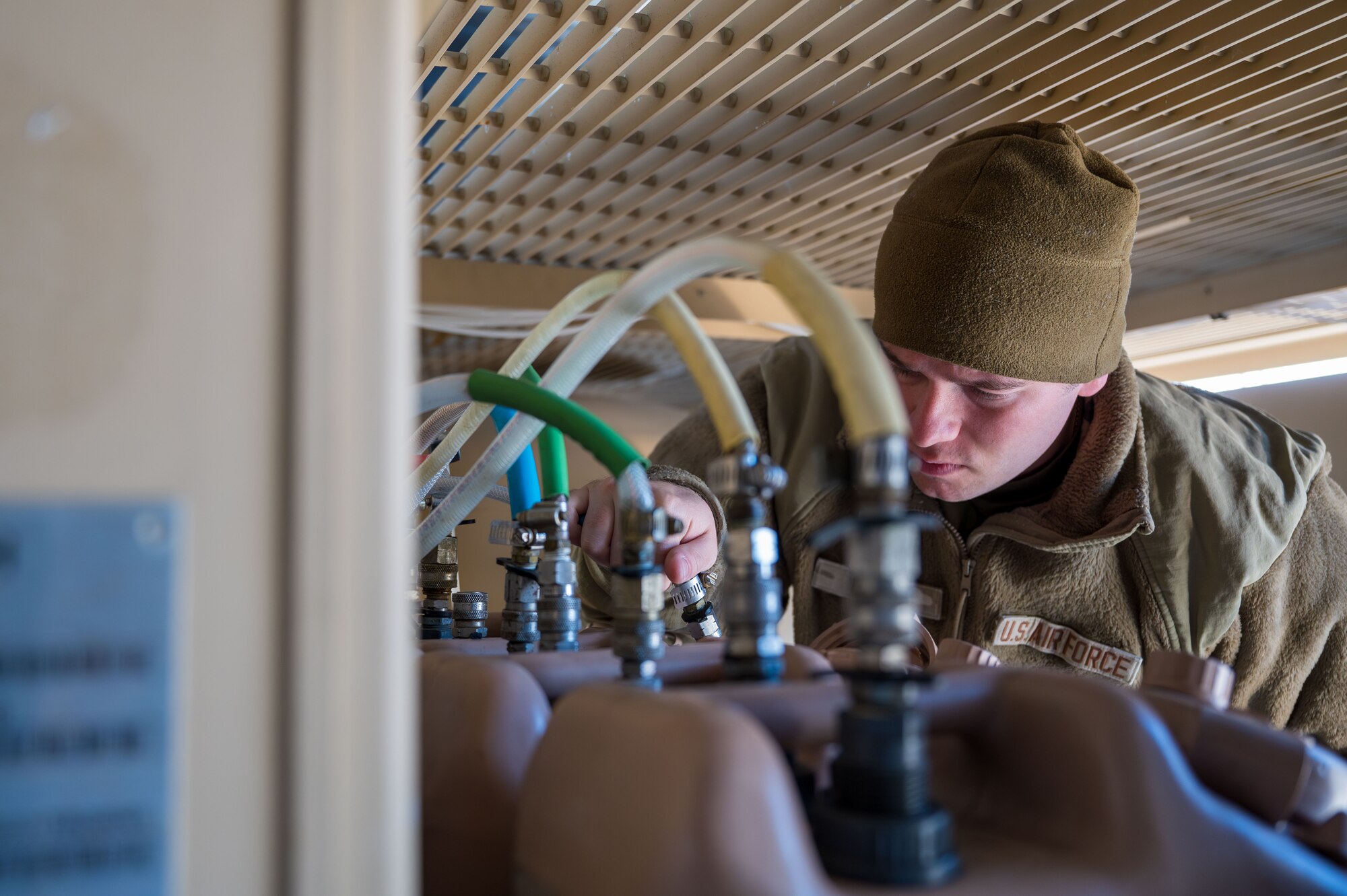 A U.S. Airman assigned to the 11th Air Task Force adjusts the chemical output for the water supply at Tyndall Air Force Base, Florida, Jan. 26, 2025. Airmen set up new water supplies after experiencing a simulated severe weather event. (U.S. Air Force photo by Senior Airman Jasmyne Bridgers-Matos)