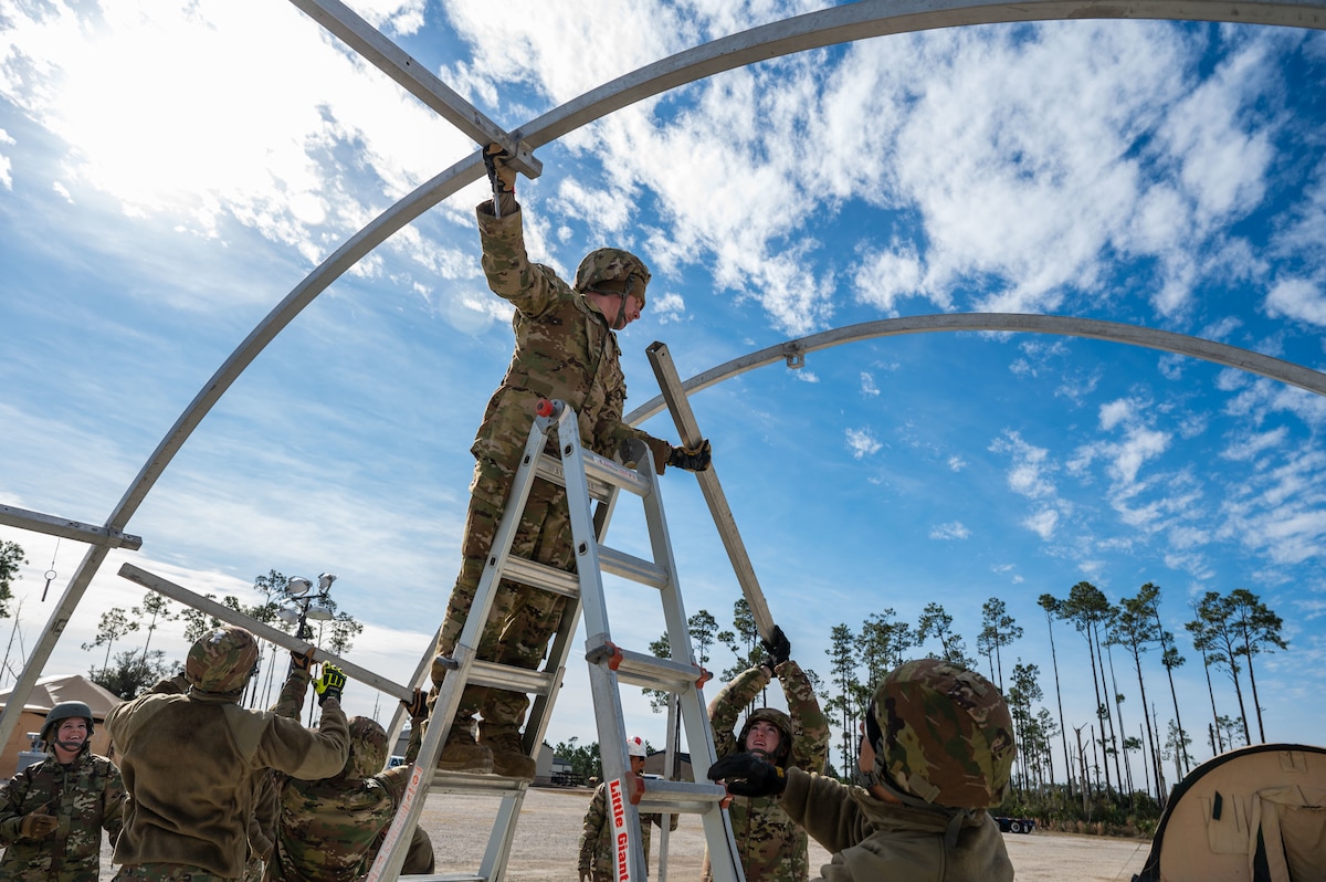 U.S. Airmen assigned to the 11th Air Task Force construct a tent at Tyndall Air Force Base, Florida, Jan. 21, 2025. The 11th ATF empowers Airmen to execute the mission while optimizing agile combat employment to advance the capabilities of air power and overcome the challenges of tomorrow. (U.S. Air Force photo by Senior Airman Jasmyne Bridgers-Matos)