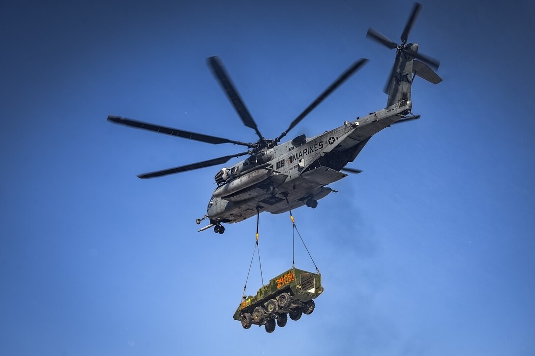 A CH-53E Super Stallion helicopter assigned to Marine Heavy Helicopter Squadron 772 relocates a Stryker armored vehicle at Fort Indiantown Gap, P.A., Jan. 22, 2025. The helicopter was requested on behalf of the Pennsylvania Army National Guard to lift and relocate nine Stryker armored vehicles to the Fort Indiantown Gap training range. The lift was assisted by a team of U.S. Air Force Airmen assigned to the 621st Contingency Response Group who secured and released each Stryker to the helicopter. (U.S. Air Force photo by Senior Airman Matt Porter)