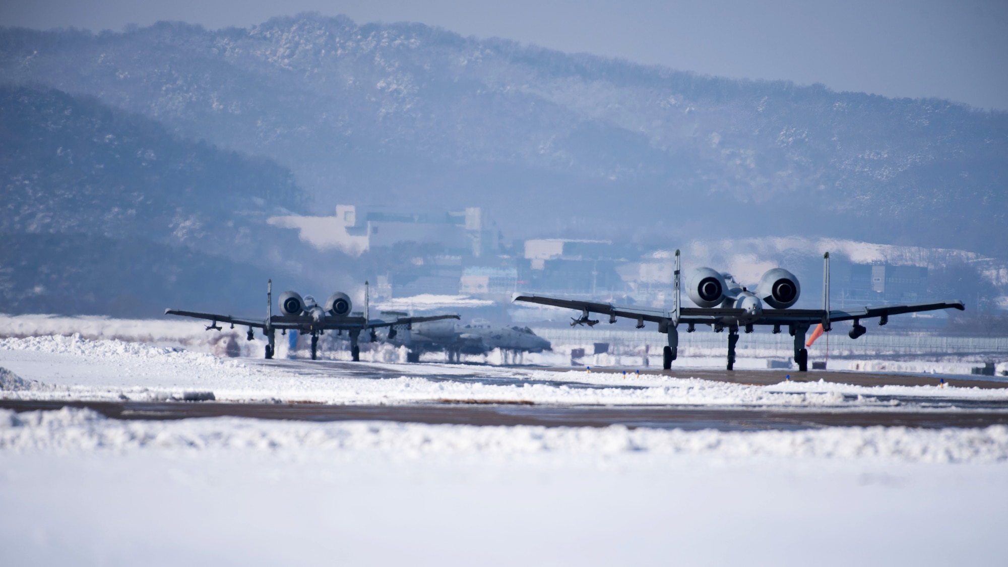 Two U.S. Air Force A-10 Thunderbolt IIs assigned to the 25th Fighter Squadron taxi on the flight line during Beverly Herd 25-2, at Osan Air Base, Republic of Korea, Jan. 29, 2025. Large force exercises like BH 25-2 involve multiple units and simulated enemy threats across a variety of contingency scenarios. (U.S. Air Force photo by Senior Airman Sabrina Fuller-Judd)