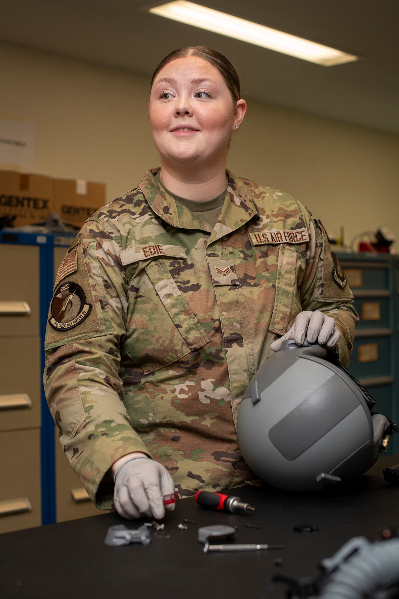 An Airman configures a HGU-55/P Helmet.