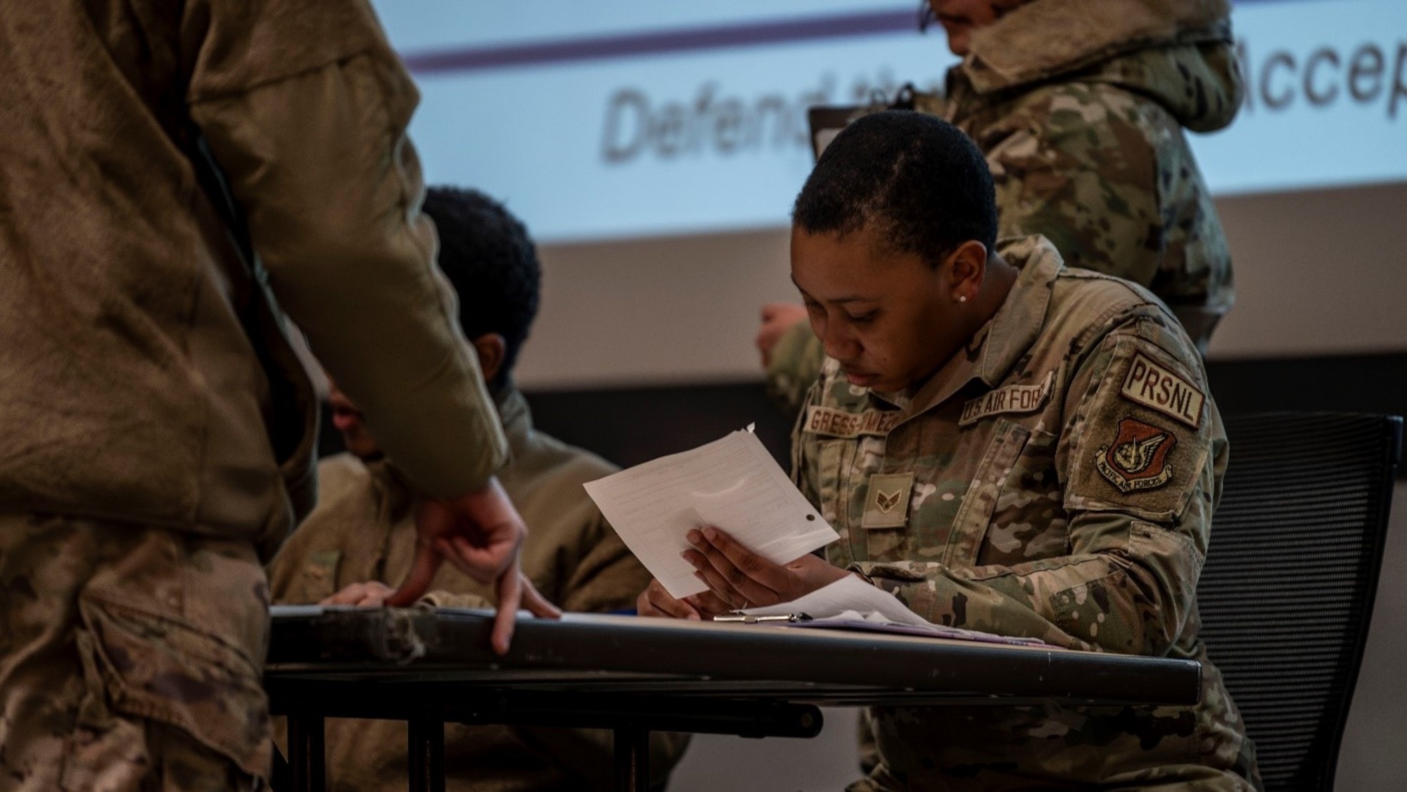 U.S. Air Force Senior Airman Gianna Gress-Gomez, 8th Force Support Squadron personnelist, simulates in-processing a 51st Fighter Wing member for agile combat employment training at Kunsan Air Base, Republic of Korea, Jan. 27, 2025. A contingency team of over 200 Airmen relocated to Kunsan AB in support of ACE operations during exercise Beverly Herd 25-2. (U.S. Air Force photo by Staff Sgt. Ashley N. Mikaio)