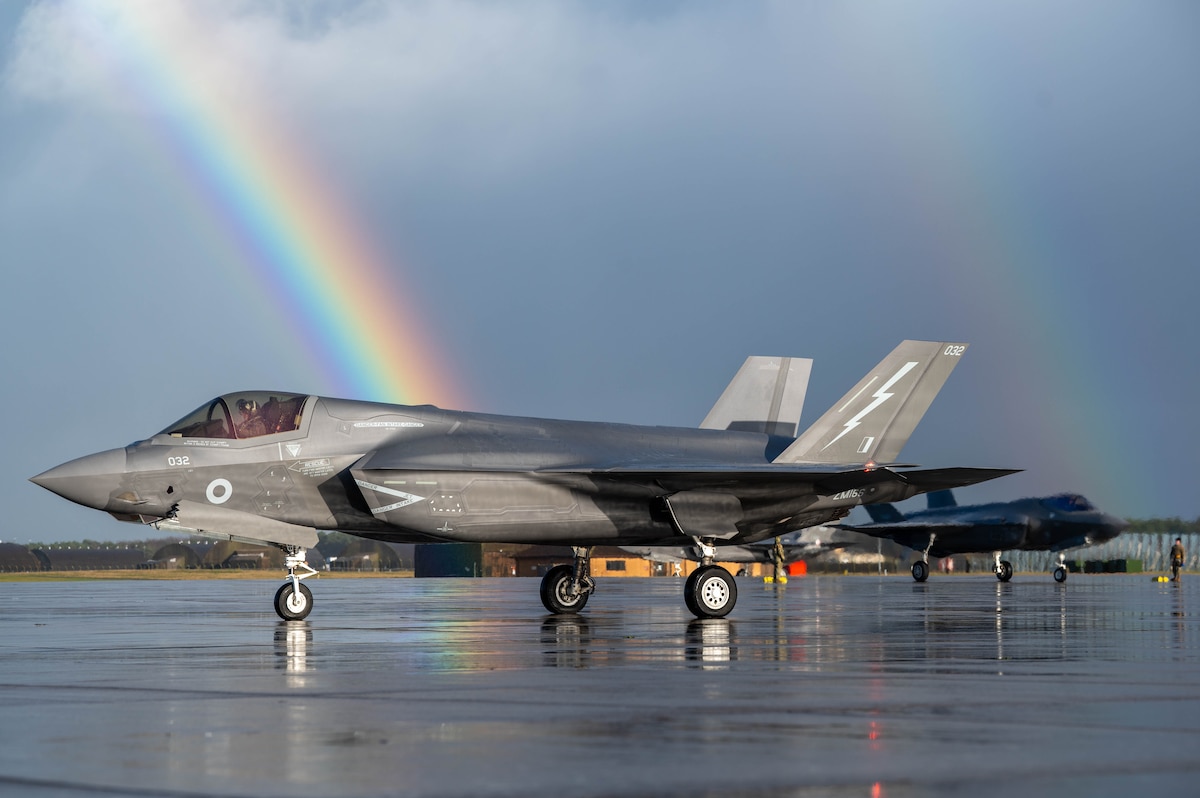 An F-35B pictured near a rainbow.