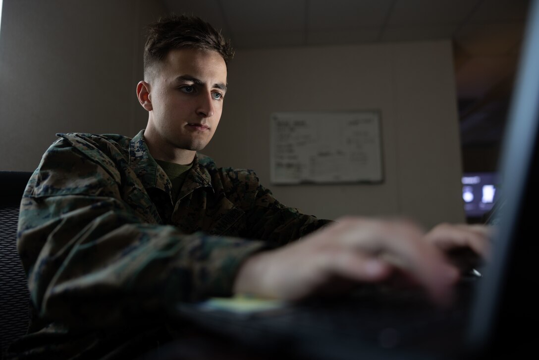 U.S Marine Corps Pfc. Joseph T. Antinori, a production and analysis intelligence specialist, with Headquarters and Service Battalion, 2nd Marine Logistics Group, and a native of Tampa, Florida, reviews an upcoming intel presentation on Camp Lejeune, North Carolina, Jan. 15, 2025. Antinori was selected as warrior of the week for his hard work and contagious gung-ho attitude that helps lead himself and others to mission accomplishment. When asked how he felt about being the Warrior of the Week, Antinori said, “I’ve had all kinds of jobs before the Marine Corps but this is the first job where I get paid to think. It’s an amazing opportunity.” Each week, 2nd MLG recognizes one outstanding Marine or Sailor that goes above and beyond in their duties and embodies the qualities of an outstanding service member. (U.S. Marine Corps Photo by Lance Cpl. Javier Santillan)