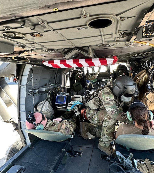 Capt. Lauren Poulson, 36th Aeromedical Evacuation Squadron flight nurse, participates in an Army helicopter medical rescue and evacuation training during her deployment.