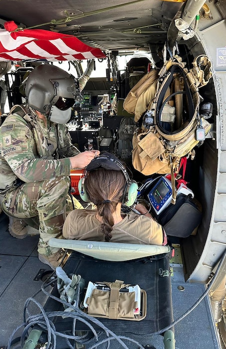 Capt. Lauren Poulson, 36th Aeromedical Evacuation Squadron flight nurse, participates in an Army helicopter medical rescue and evacuation training during her deployment