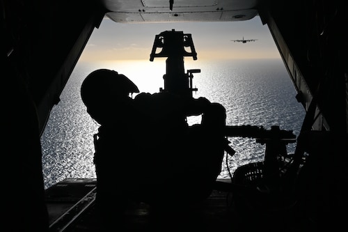 Aircrew sits at the back on a CV-22