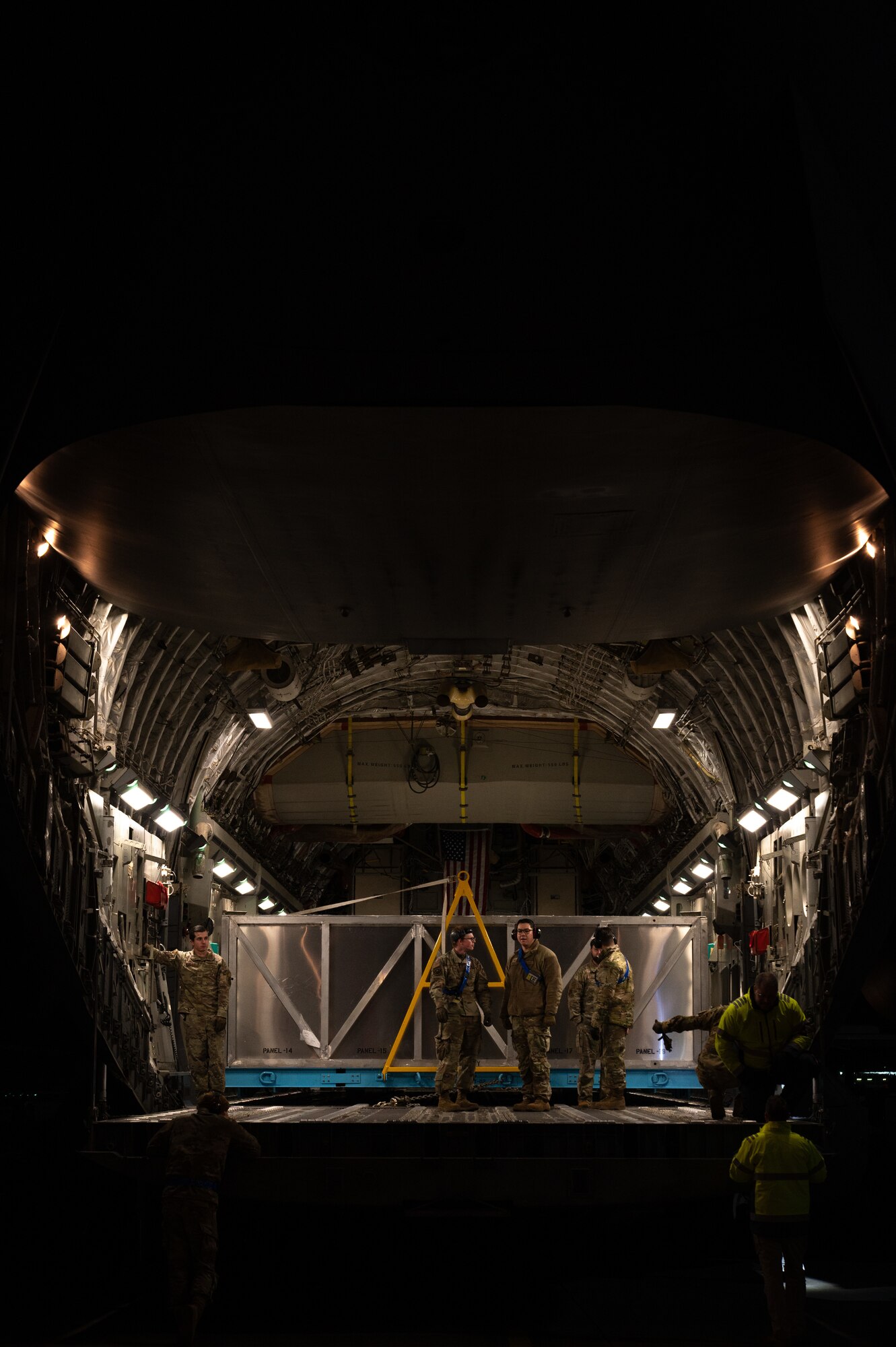 Airmen wait in a C-17