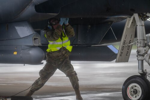 Airman performing hot pit refueling