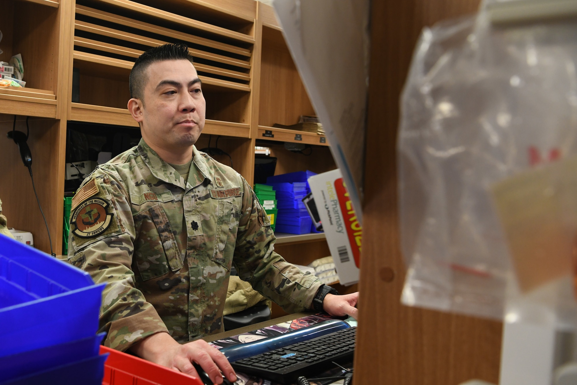 Air Force Lt. Col. Sang Ngo, 27th Special Operations Healthcare Operations Squadron diagnostic and therapeutics flight commander, checks a prescription on his computer at Cannon Air Force Base, New Mexico, Jan. 14, 2025. The pharmacy team at the 27th Special Operations Medical Group has made significant strides in improving patient care and efficiency, addressing staffing shortages and modernizing processes to better serve the base community. (U.S. Air Force photo by Senior Airman Drew Cyburt)