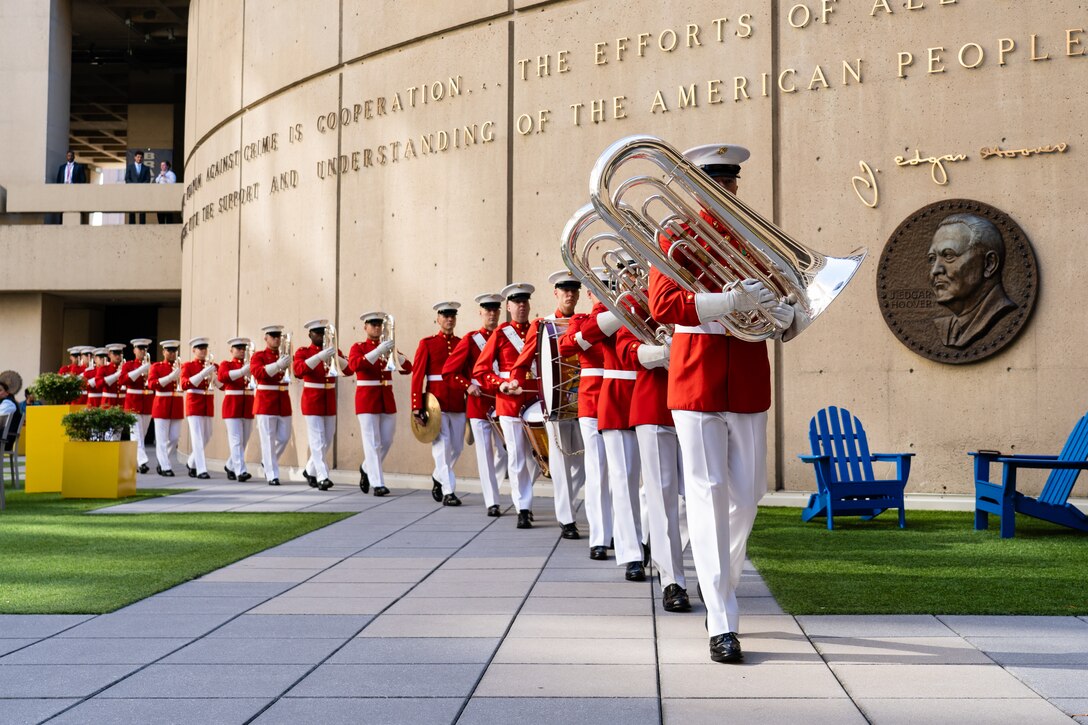 “The Commandant’s Own”, U.S. Marine Drum and Bugle Corps performs at the FBI Headquarters, Nov. 6, 2024. “The Commandant’s Own,” performed multiple songs to showcase esprit de corps and honor veterans past and present. (U.S. Marine Corps photo by Sgt Jeremy Cover)