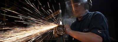 PACIFIC OCEAN (Jan. 27, 2025) — Hull Maintenance Technician Fireman Caden Lucek, from Cottage Grove, Oregon, grinds scrap metal aboard the aircraft carrier USS Nimitz (CVN 68) in the Pacific Ocean, Jan. 27, 2025. Nimitz is underway in U.S. 3rd Fleet conducting routine training operations. (U.S. Navy photo by Mass Communication Specialist 2nd Class Caylen McCutcheon)
