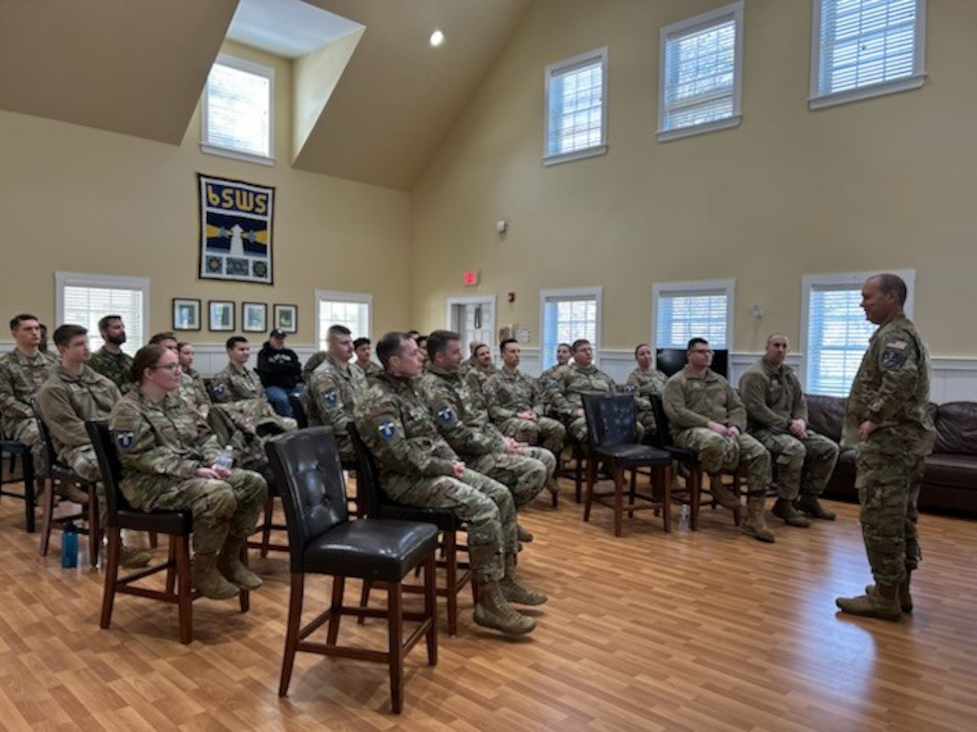 A Space Force general meets with military members in uniform