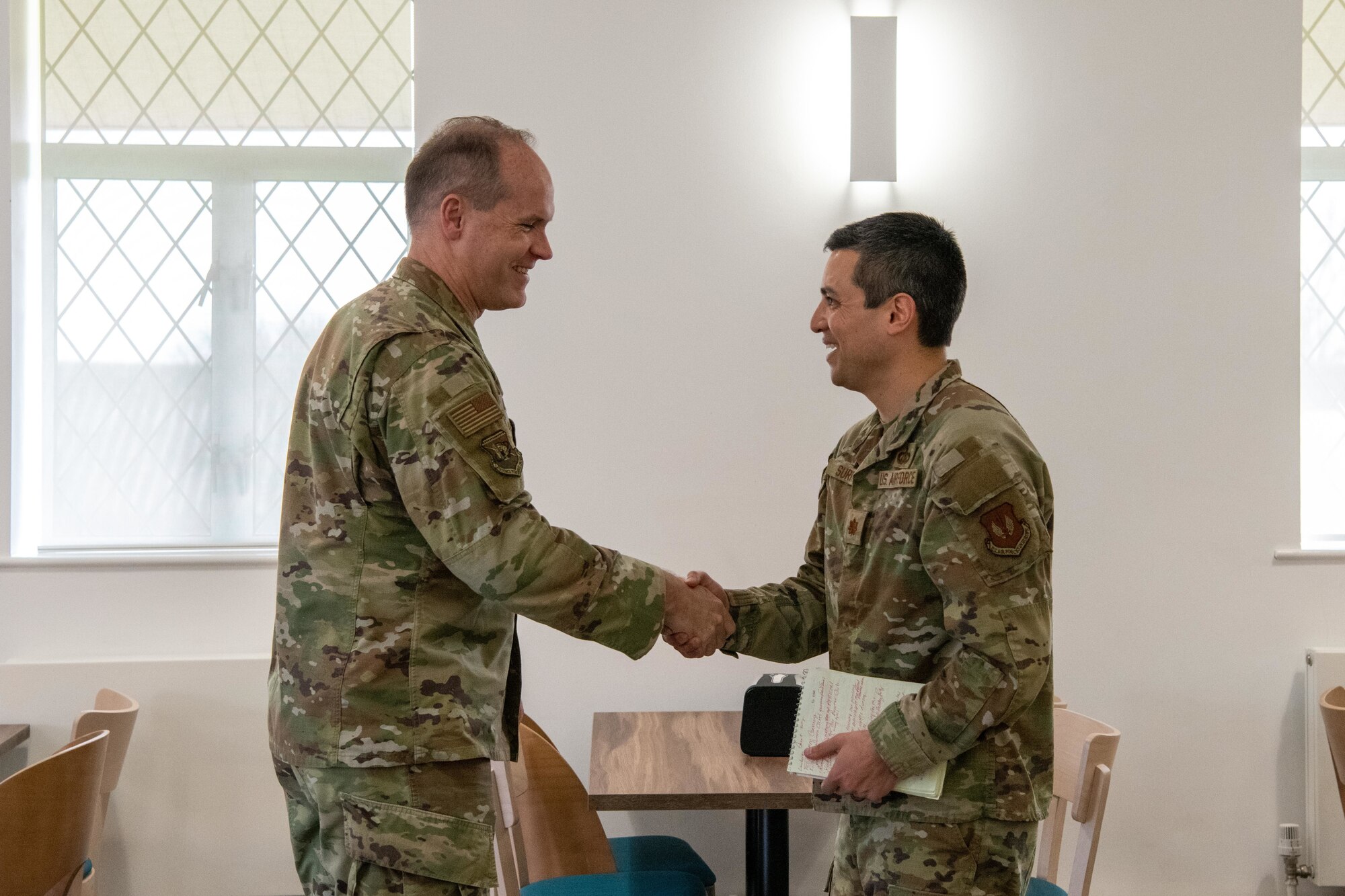 Airmen shake hands