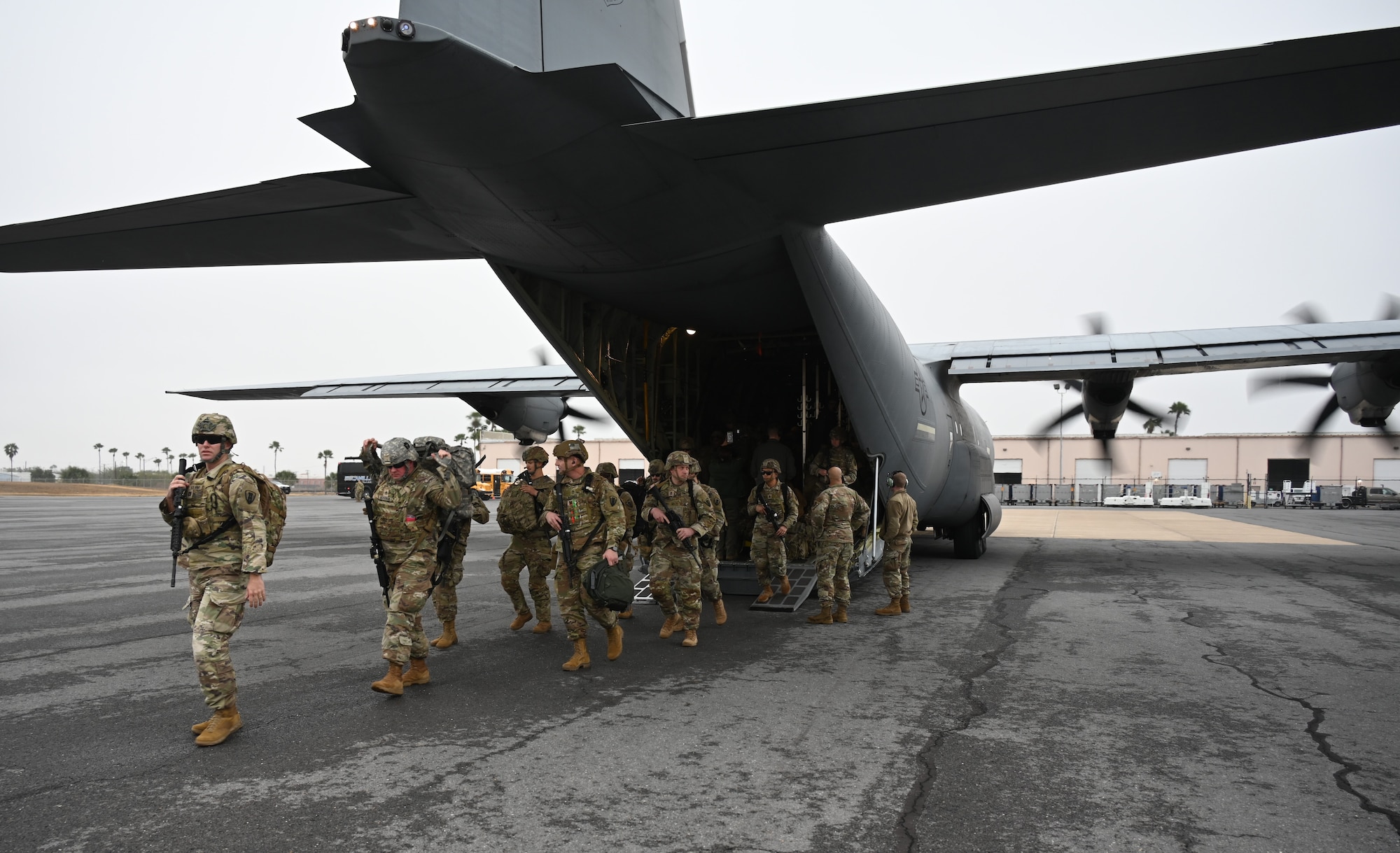 Troops exit C-130J at southern border