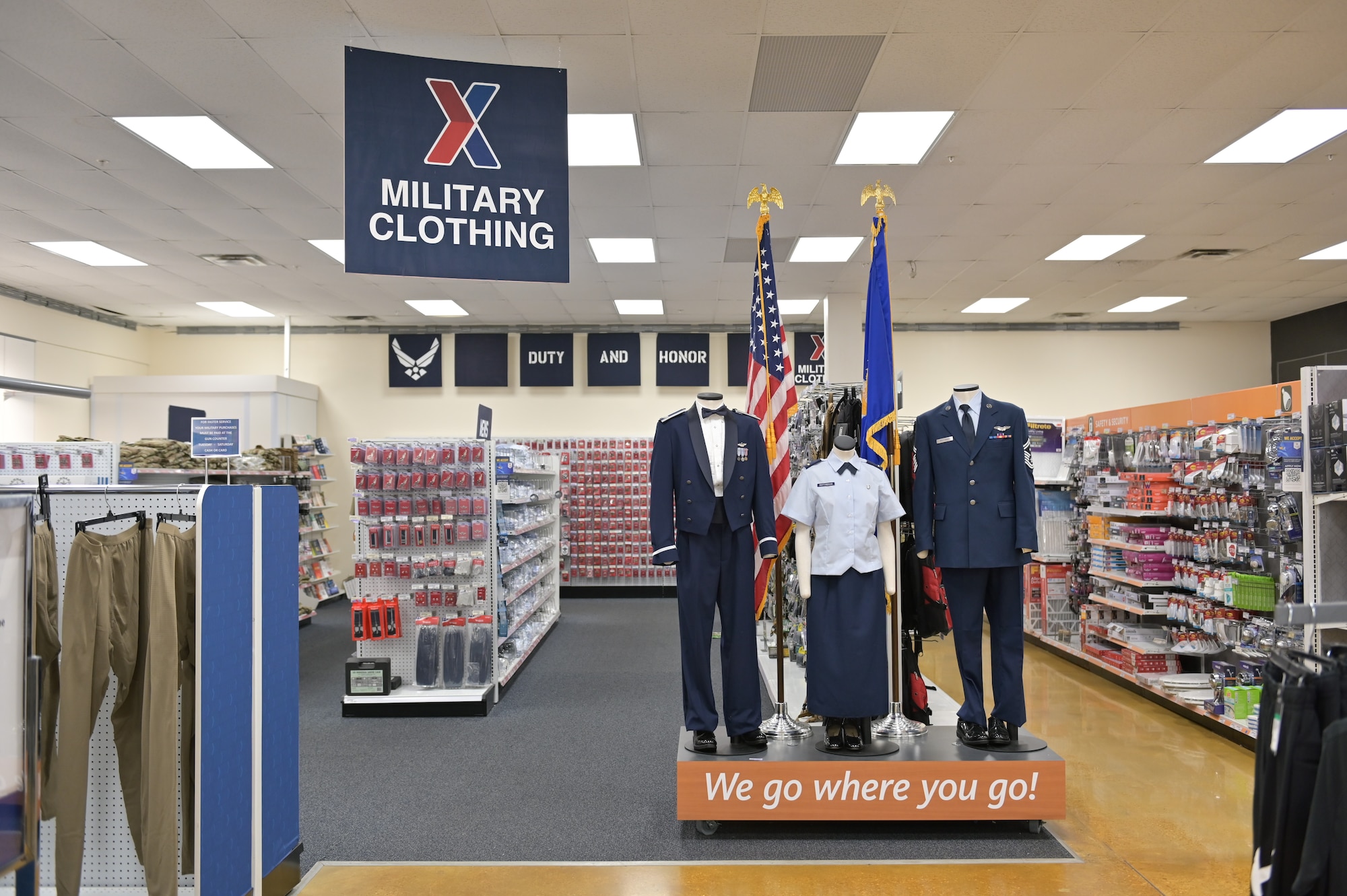 Several sets of dress blues are featured on a podium in the Columbus Air Force Base Exchange.