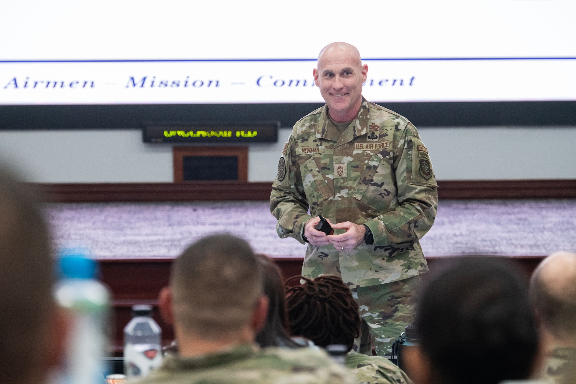 U.S. Air Force Chief Master Sgt. Jamie Newman, Air Mobility Command command chief, briefs squadron leaders and their spouses during the AMC Squadron Leadership Course, Jan. 27, 2025, at Scott Air Force Base, Ill. After graduating from the course, attendees leave the class with a certification showcasing that they have acquired the experience and resources to lead in a squadron command leadership or spouse role. (U.S. Air Force Photo by Staff Sgt. Dalton Williams)