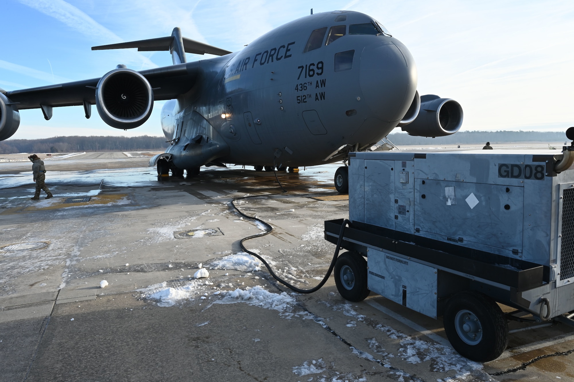 A C-17 Globemaster III aircraft sits parked