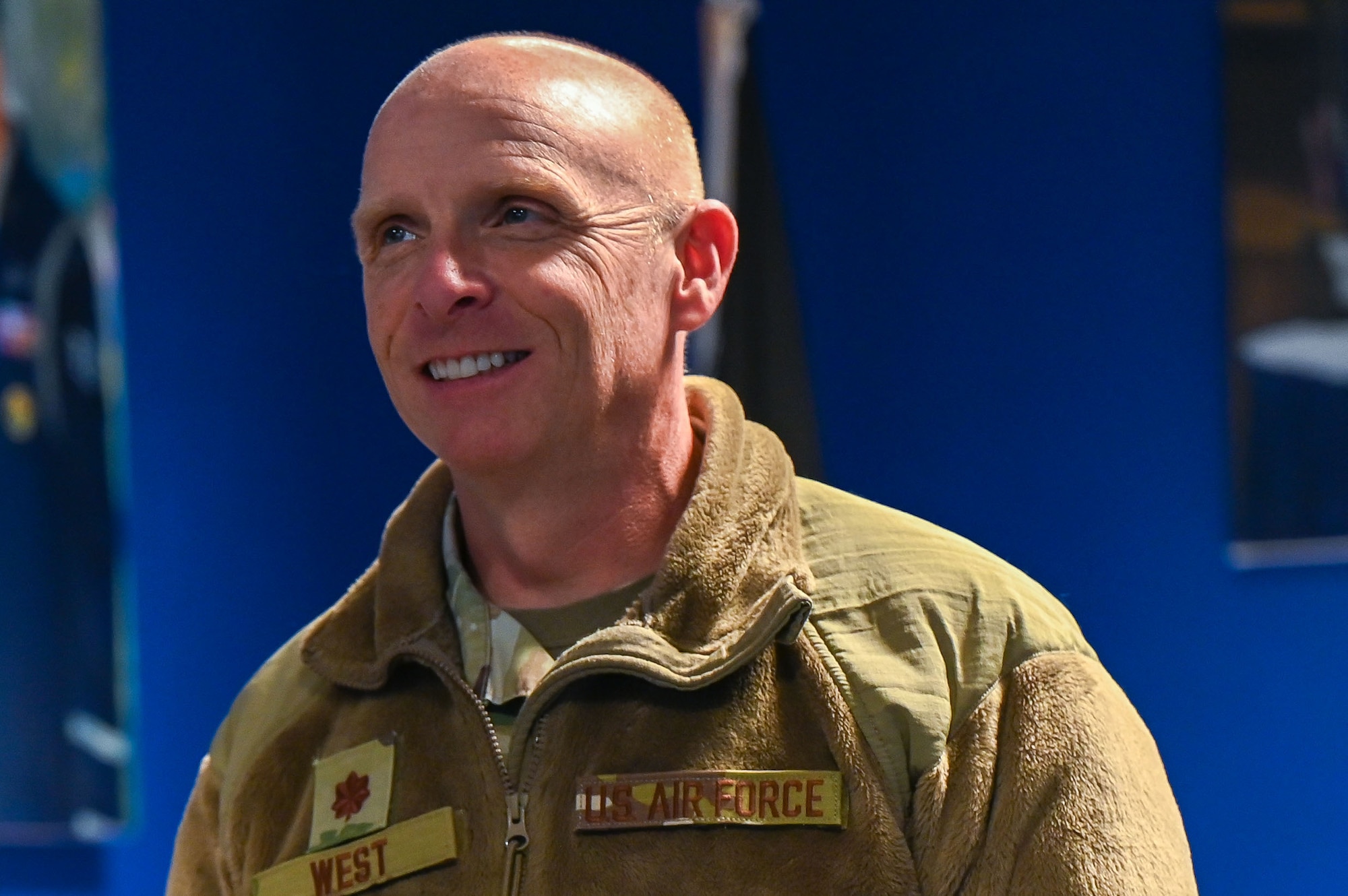 U.S. Air Force Maj. Thomas West, Air Force Chaplain Corps College staff chaplain smiles as he walks into the Honor Guard Hangar at Maxwell Air Force Base, Alabama, Jan. 28, 2025.