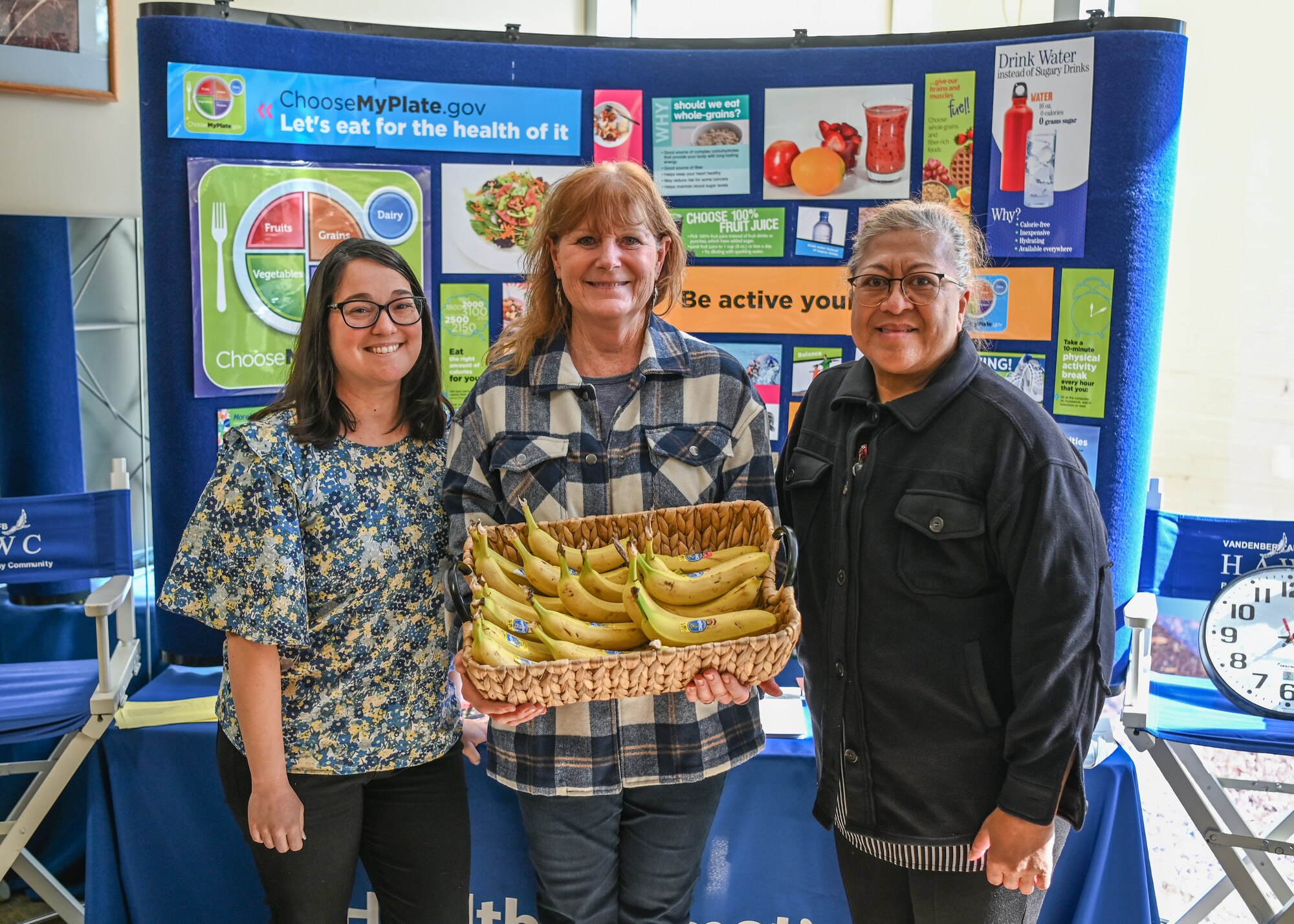 A 30th Medical Group health promotion manager (left), a 30th Medical Group clinical dietitian (right), and a 30th Medical Group clinical dietitian (middle), pose for a photo during Biomedical Sciences Corps Week at Vandenberg Space Force Base.