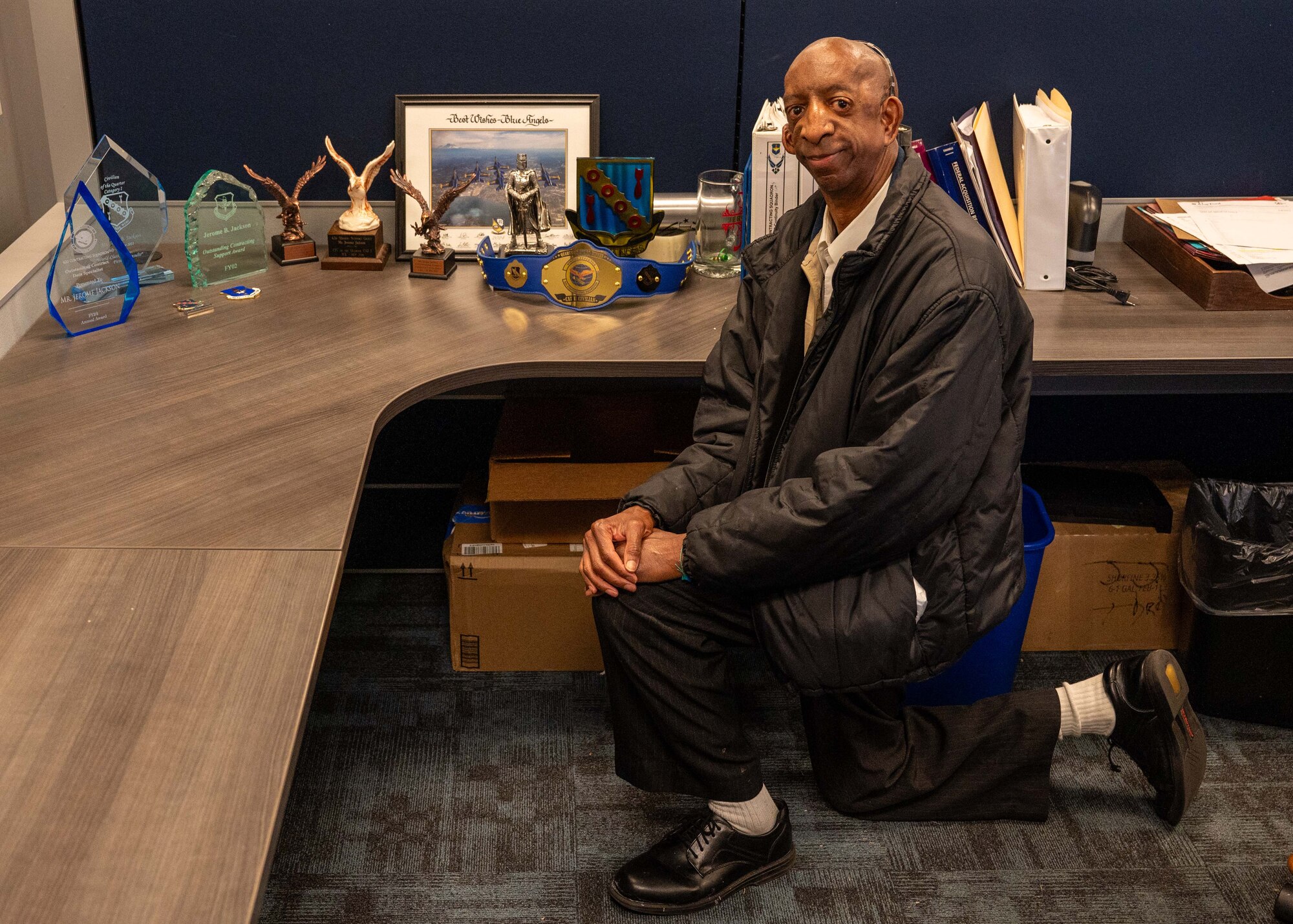 U.S. Air Force Lt. Col. Bryce Fiacco, 42nd Contracting Squadron commander, checks in about an upcoming appointment with Jerome Jackson, 42nd Contracting Squadron procurement technician at Maxwell Air Force Base, Alabama, Jan. 27, 2025.