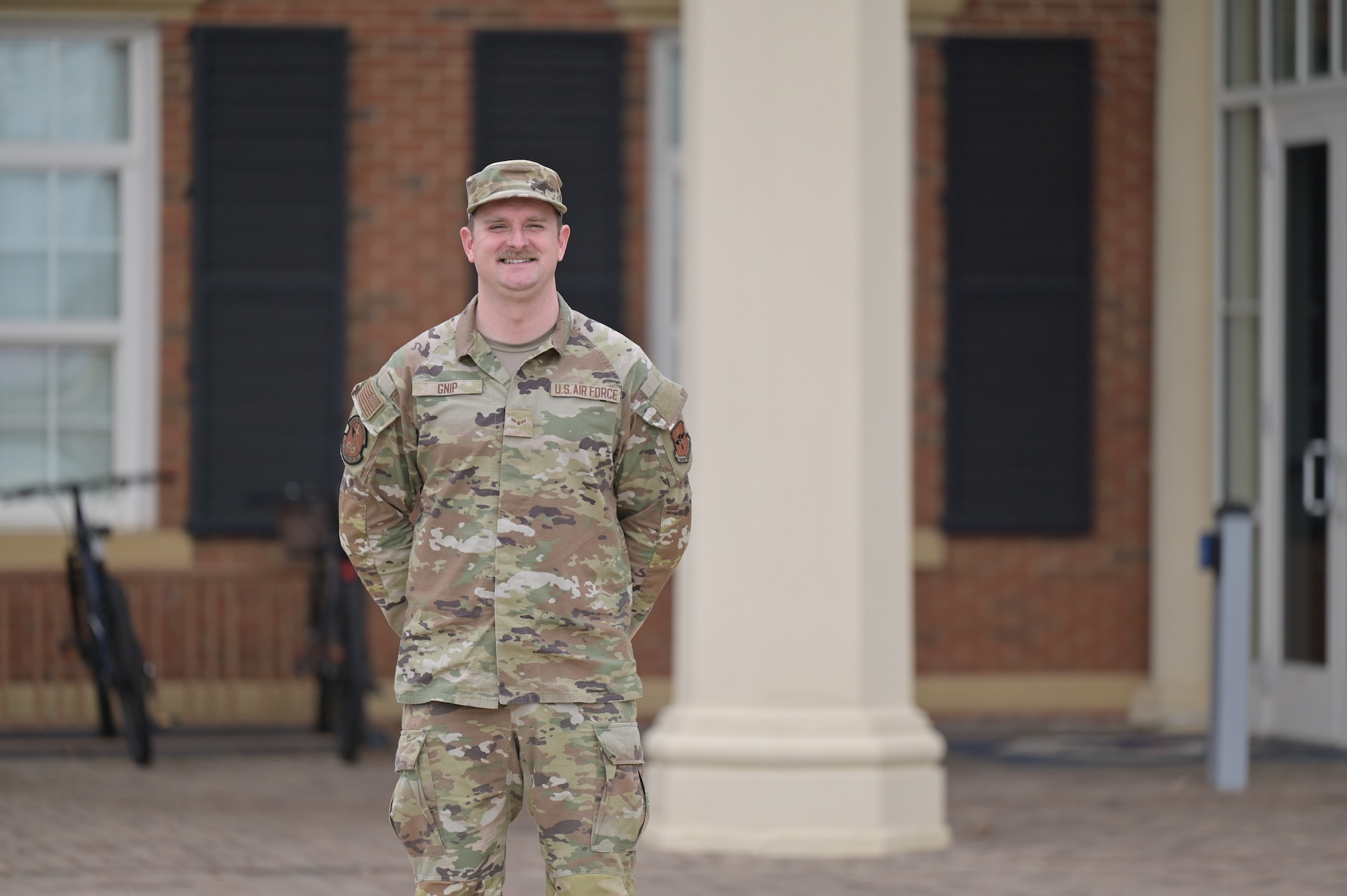 Airman 1st Class Michael Gnip,14th Comptroller Squadron financial management specialist, poses for a photo outside the 14th Mission Support Group building on Columbus Air Force Base, Jan. 30, 2025.