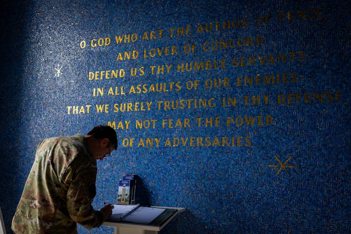 Gen. Kevin Schneider signs the guest book at the Manila American Cemetery.