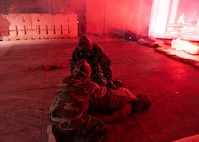 U.S. Air Force medics conducted a high-intensity Tactical Combat Casualty Care (TCCC) exercise in a simulated chemically contaminated environment on Jan. 31, 2025, at the 59th Medical Readiness Training Center, Joint Base San Antonio-Camp Bullis, Texas.