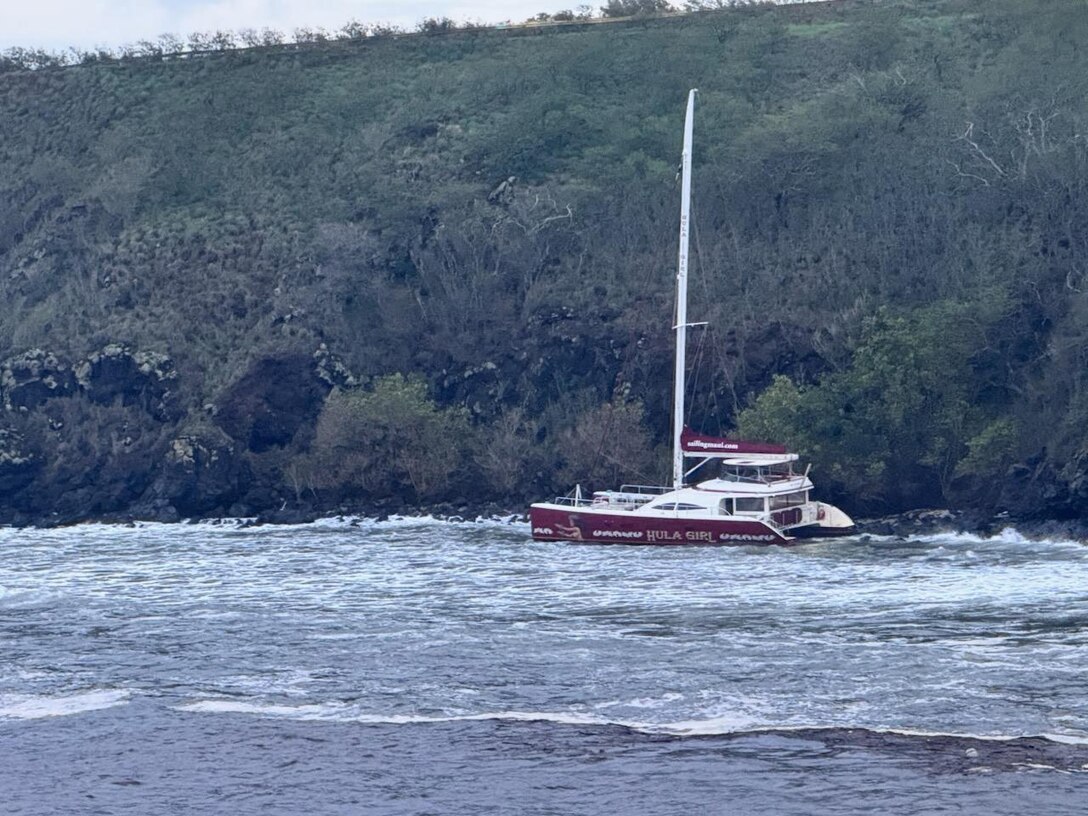 The Hula Girl, a 65-foot commercial catamaran, sits aground on the north side of Honolua Bay in Maui Jan. 31, 2025. Coast Guard Marine Safety Team Maui and Coast Guard Sector Honolulu personnel are working alongside Department of Land and Natural Resources personnel to mitigate any environmental hazards. (U.S. Coast Guard photo, courtesy Department of Land and Natural Resources)