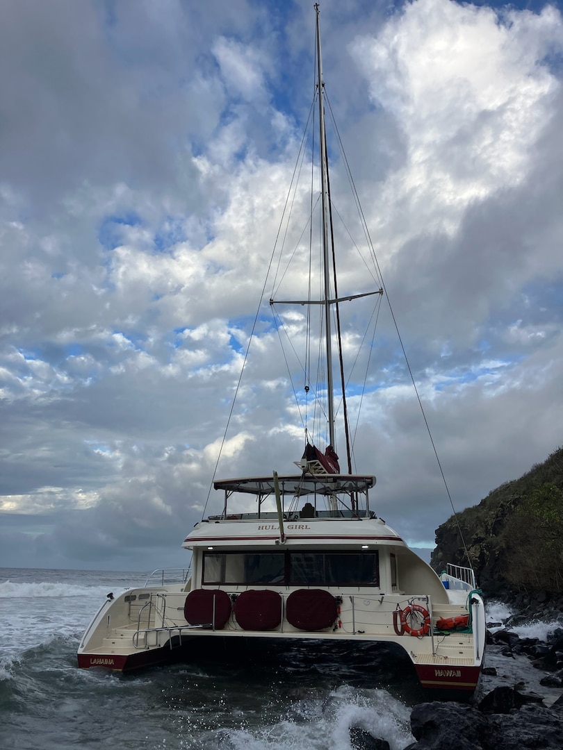 The Hula Girl, a 65-foot commercial catamaran, sits aground on the north side of Honolua Bay in Maui Jan. 31, 2025. The four crew members aboard the catamaran safely disembarked the vessel after it ran aground during inclement weather. (U.S. Coast Guard photo, courtesy Department of Land and Natural Resources)