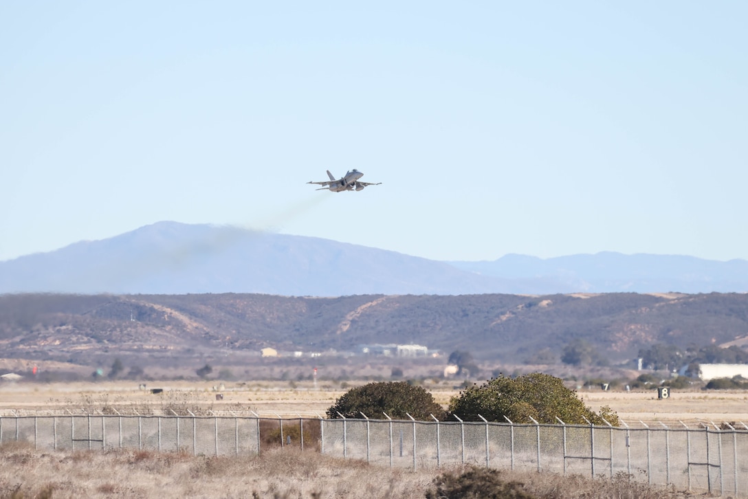 An F/A-18 Hornet assigned to Marine Fighter Attack Squadron (VMFA) 323, Marine Aircraft Group 11, 3rd Marine Aircraft Wing, takes off from Marine Corps Air Station Miramar, California, during a Large Force Exercise conducted by MAG-11 and MAG-13 on Jan. 15, 2025. LFE is a high-fidelity combat training event over the Southern California coast, incorporating defensive counter-air and air interdiction missions. The exercise provides pilots with invaluable experience in mission planning and execution, including opportunities to serve as division leads or mission commanders. (U.S. Marine Corps photo by Lance Cpl. Alexis Ibarra)