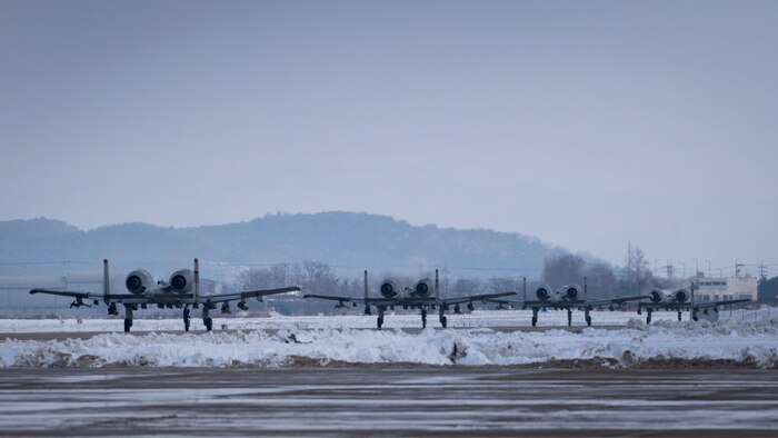 Four U.S. Air Force A-10 Thunderbolt IIs assigned to the 25th Fighter Squadron taxi down on flight line during Beverly Herd 25-2, at Osan Air Base, Republic of Korea, Jan. 29, 2025. The 51st Fighter Wing regularly schedules readiness exercises, such as BH 25-2, to test and validate Osan's offensive and defensive capabilities during contingency scenarios. (U.S. Air Force photo by Senior Airman Sabrina Fuller-Judd)