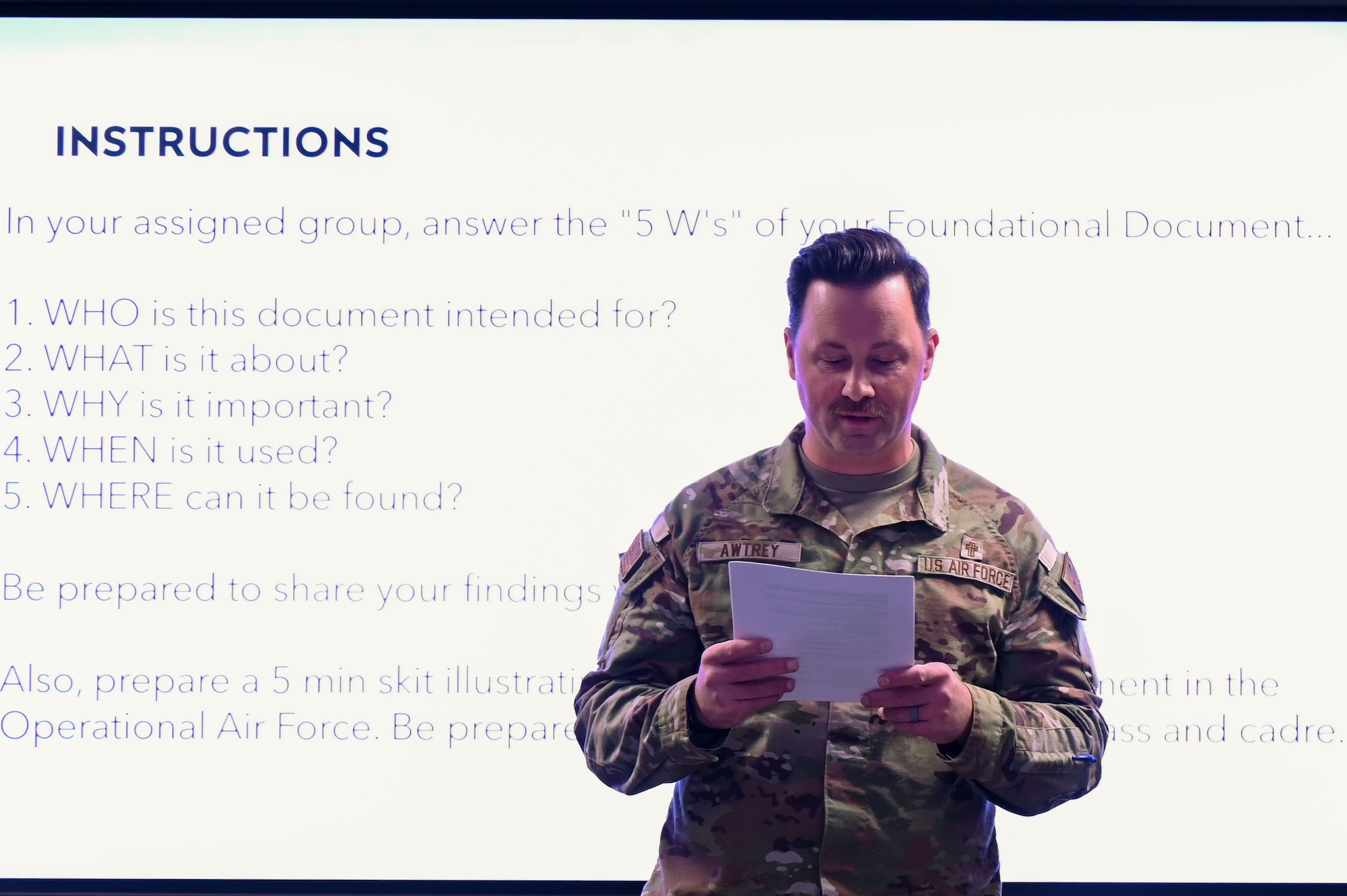 U.S. Air Force Capt. Matthew A. Awtrey, U.S. Air Force Academy chaplain presents his team project on the Department of the Air Force Instruction at Maxwell Air Force Base, Alabama, Jan. 28, 2025.
