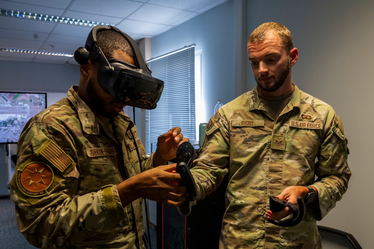 U.S. Air Force Tech. Sgt. Brandon Johnson-Farmer, left, 39th Operations Support Squadron senior watch supervisor, and Senior Airman Jacob Rigby, 39th OSS air traffic control trainer, prepare for a virtual reality simulation at Incirlik Air Base, Türkiye, June 30, 2025.