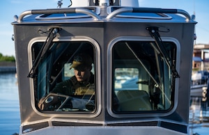 U.S. Air Force Senior Airman Justin Davis, 6th Security Forces marine patrolman, performs a pre-check on a vessel at MacDill Air Force Base, Florida, June 26, 2025. The 6th SFS Marine Patrol is the only fully operational Air Force unit that patrols the coastline 24/7.  (U.S. Air Force photo by Staff Sgt. Christopher Tam)