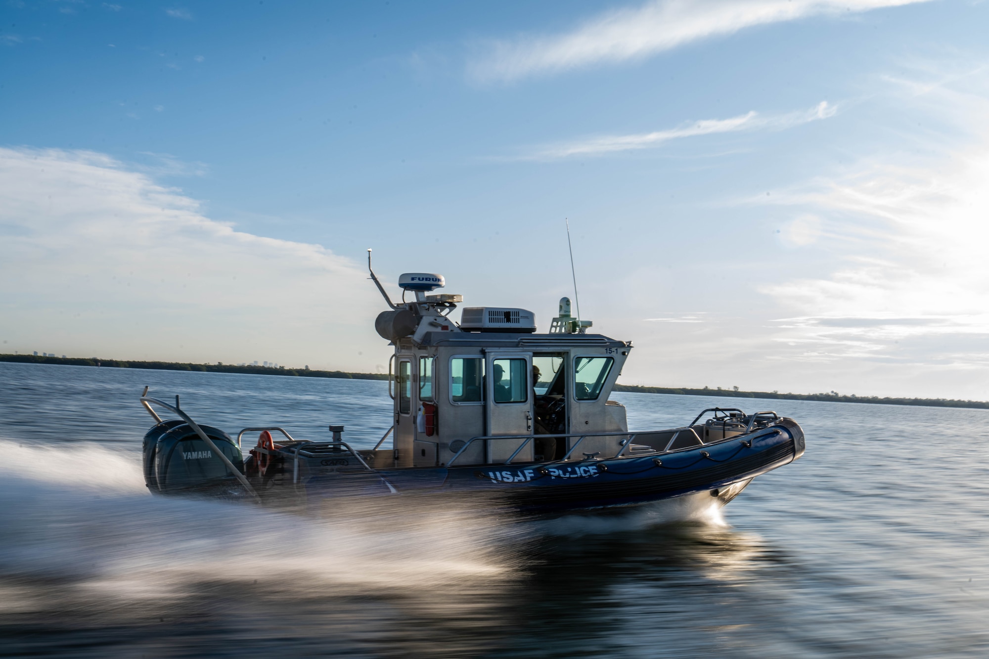 A U.S. Air Force vessel assigned to the 6th Security Forces Marine Patrol unit, monitors the coastline at MacDill Air Force Base, Florida, June 26, 2025. The 6th SFS Marine Patrol unit provides security for 7.2 miles of coastline around MacDill AFB.  (U.S. Air Force photo by Staff Sgt. Christopher Tam)