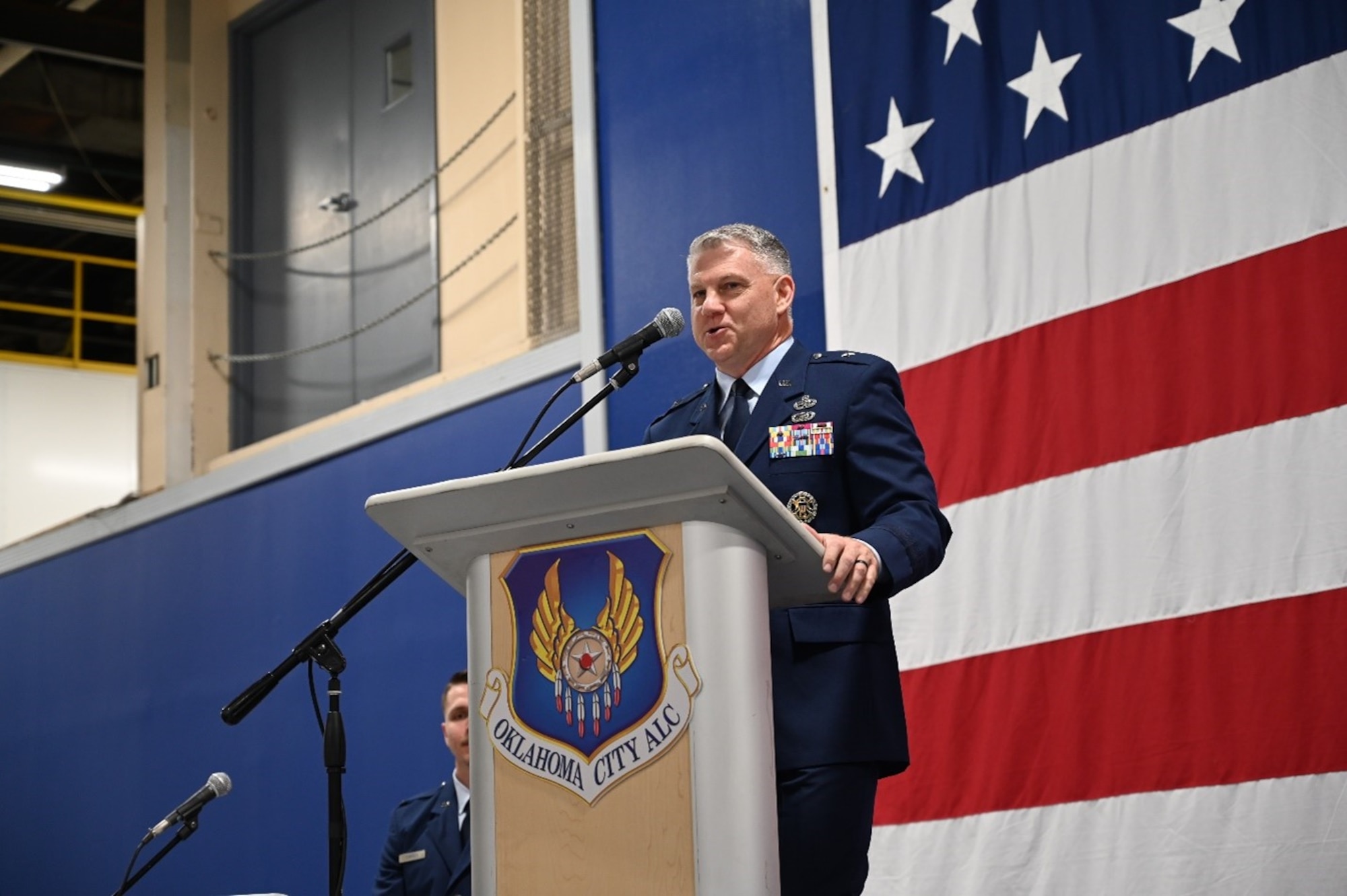 Man stands behind podium