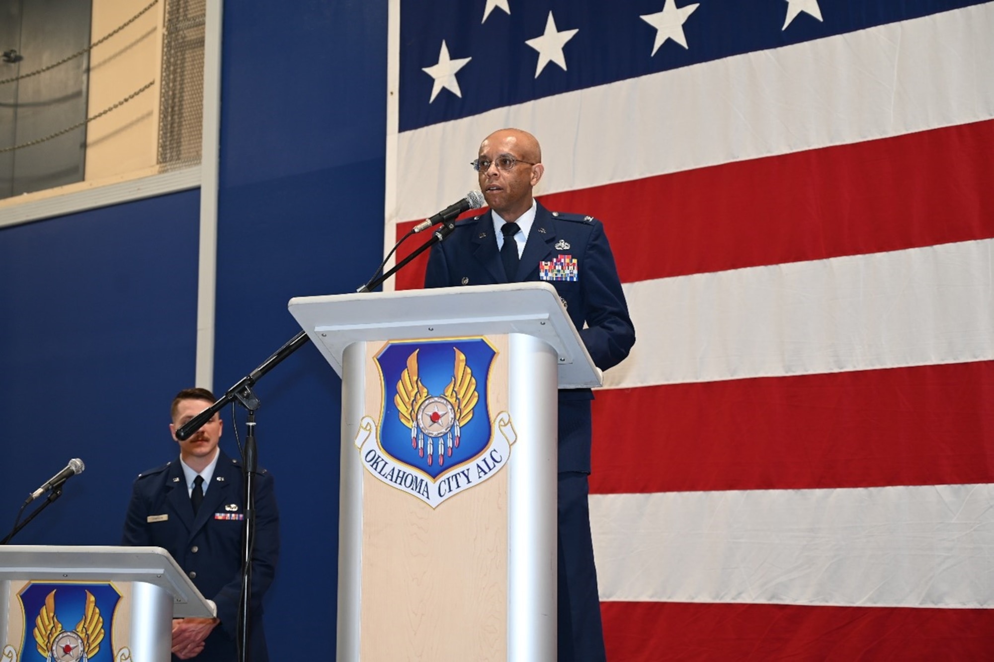 Man stands behind podium