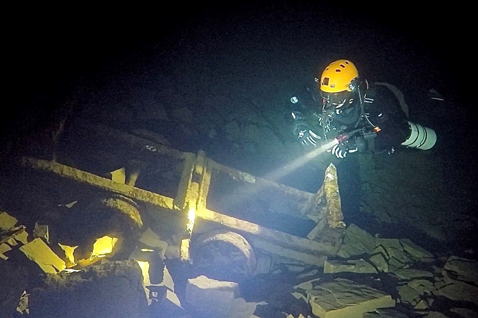 Wyatt J. Nash, Underwater Electromagnetics Stealth Advisor at Naval Surface Warfare Center Carderock Division, dives in an abandoned mine in Whales, UK. Nash is one of 10 recipients of the 2025 Assistant Secretary of the Navy (Research, Development and Acquisition) Dr. Delores M. Etter Top Scientists and Engineers of the Year Award. Carderock, the Navy's ship design and innovation powerhouse, provides the technical foundation for the future fleet through world-class research, development, and testing. (Photo courtesy of Wyatt J. Nash)