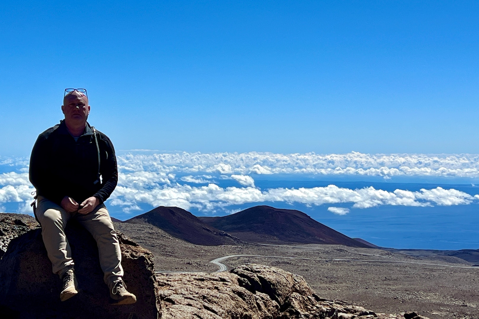 yatt J. Nash, Underwater Electromagnetics Stealth Advisor at Naval Surface Warfare Center Carderock Division, poses for a photo on top of Mauna Kea, Big Island, HI. Nash is one of 10 recipients of the 2025 Assistant Secretary of the Navy (Research, Development and Acquisition) Dr. Delores M. Etter Top Scientists and Engineers of the Year Award. Carderock, the Navy's ship design and innovation powerhouse, provides the technical foundation for the future fleet through world-class research, development, and testing. (Photo courtesy of Wyatt J. Nash)