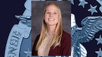 headshot of blonde woman with burgundy blazer and multicolored shirt.
