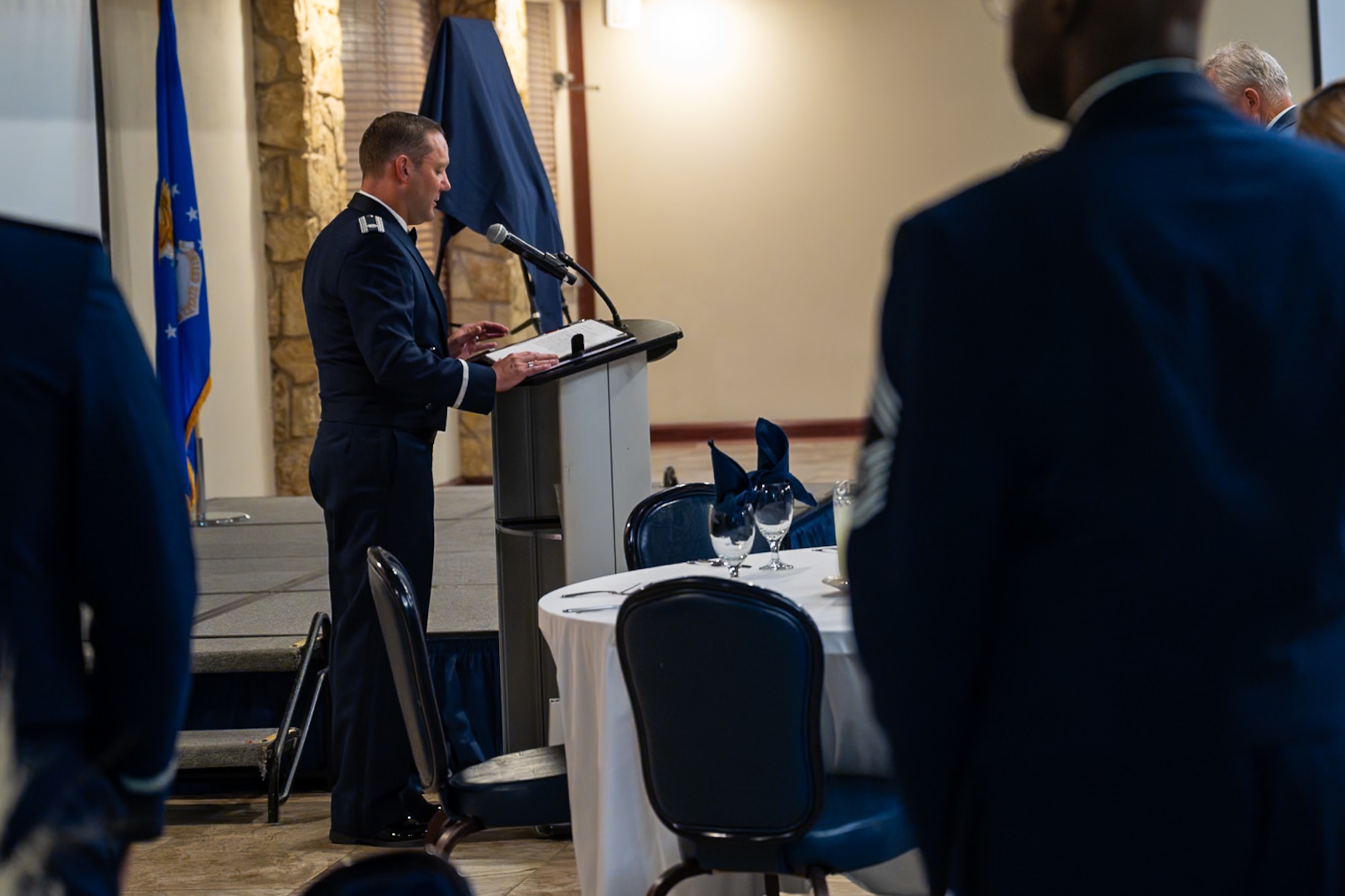 U.S. Air Force Lt. Col. Matthew Clouse, 97th Air Mobility Wing chaplain, delivers an invocation during the Friends of Altus Induction Ceremony, June 26, 2025, at Altus Air Force Base, Oklahoma. The Friends of Altus tradition honors local civilians who have demonstrated exceptional support to Altus Air Force Base. (U.S. Air Force Photo by Airman 1st Class Jonah Bliss)