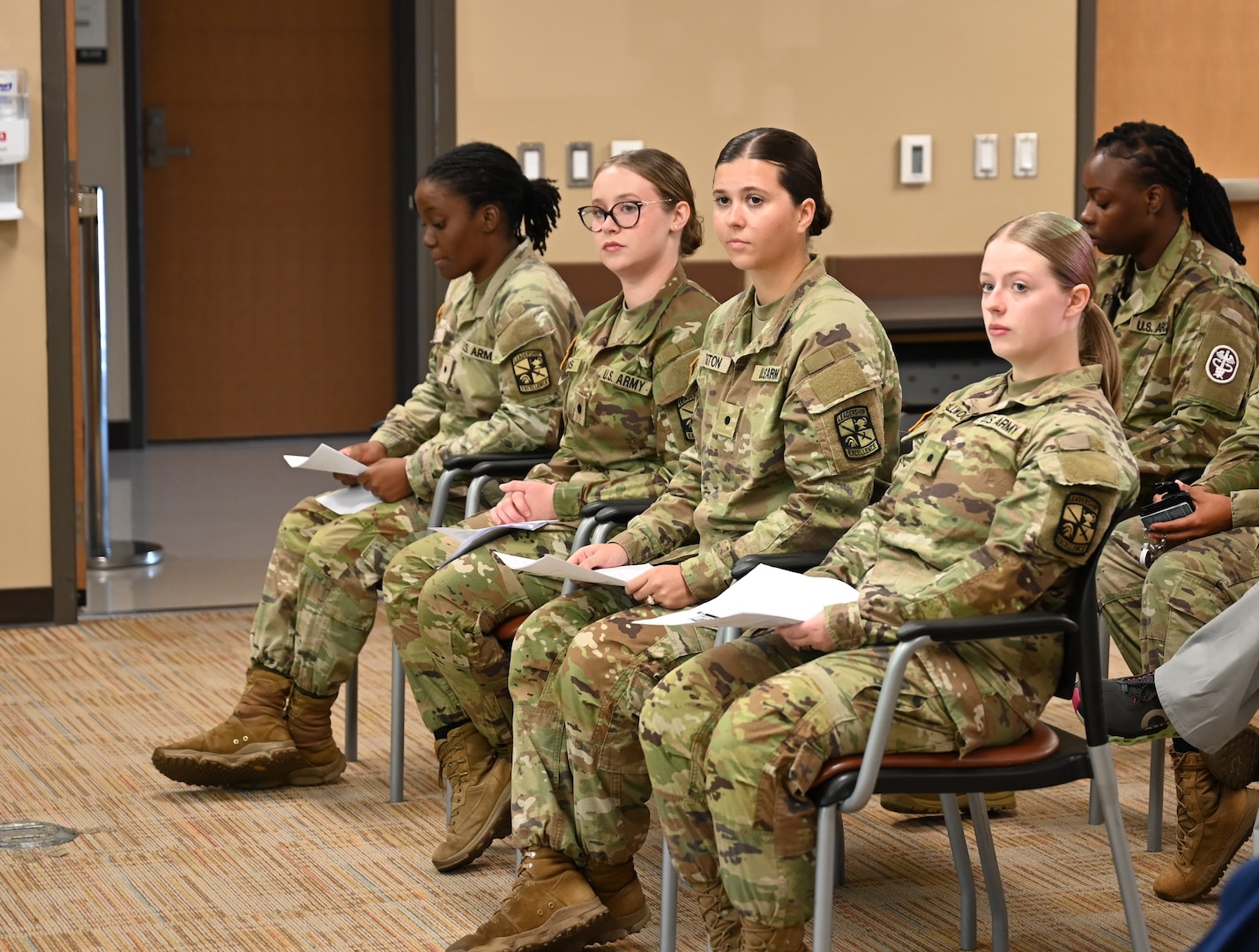 Cadets watch attentively as the Nurse Summer Training Program completion ceremony gets underway. The event marks the culmination of their 28-day clinical immersion experience.