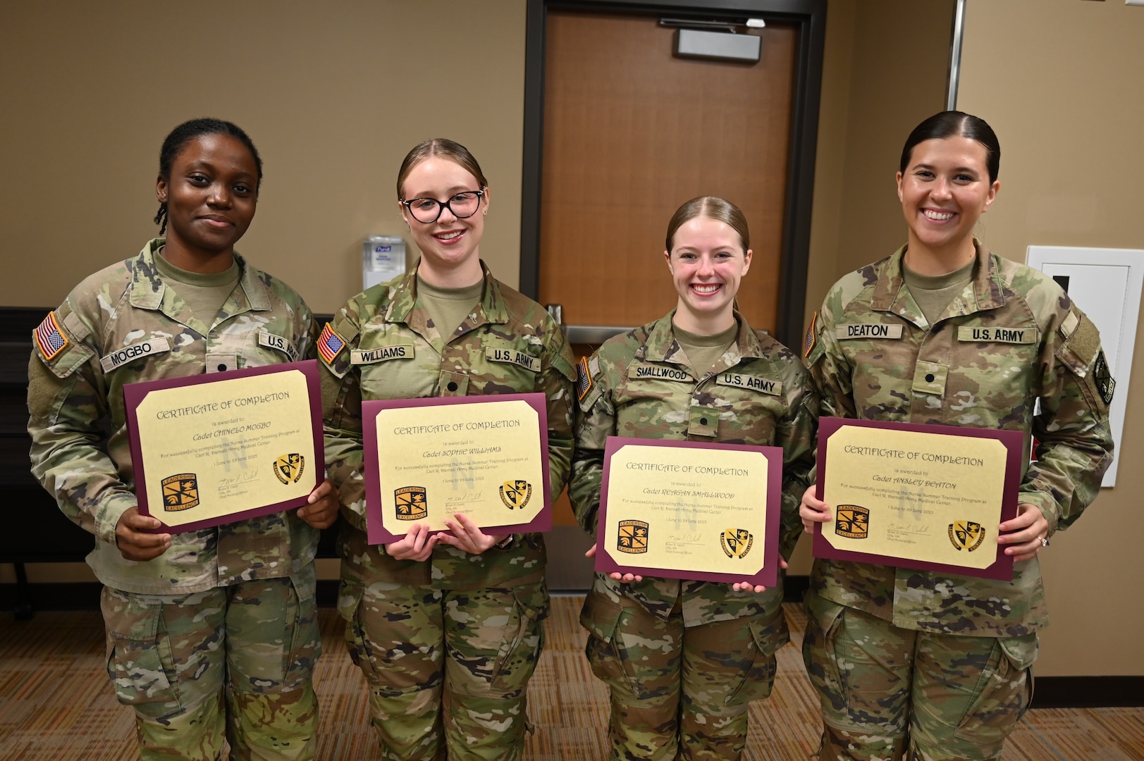 Army nurse cadets, from left, Chinelo Mogbo, Sophie Williams, Regan Smallwood, and Ansley Deaton pose for a photo after receiving their Nurse Summer Training Program completion certificates.